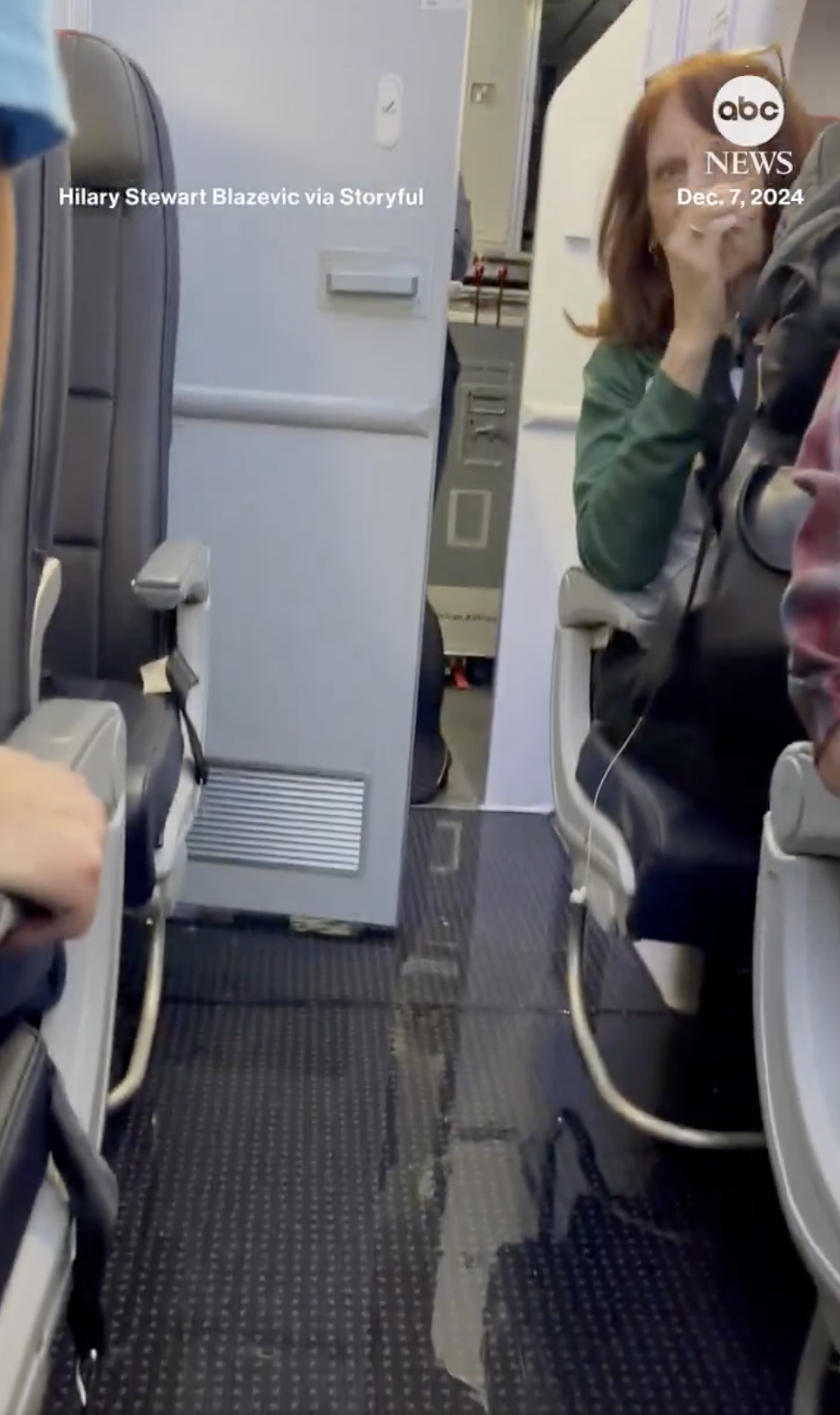 A passenger is shocked as water fills the aisle of an American Airlines plane, from a post dated December 15, 2024 | Source: X/ABC