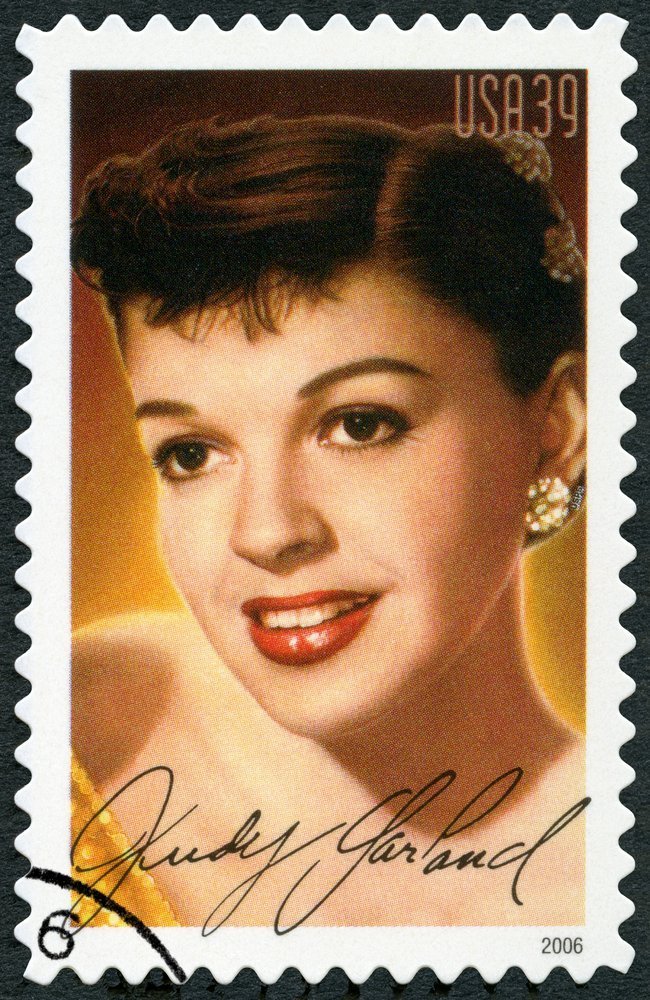 A stamp printed in USA shows portrait Judy Garland (1922-1969) | Olga Popova / Shutterstock.com