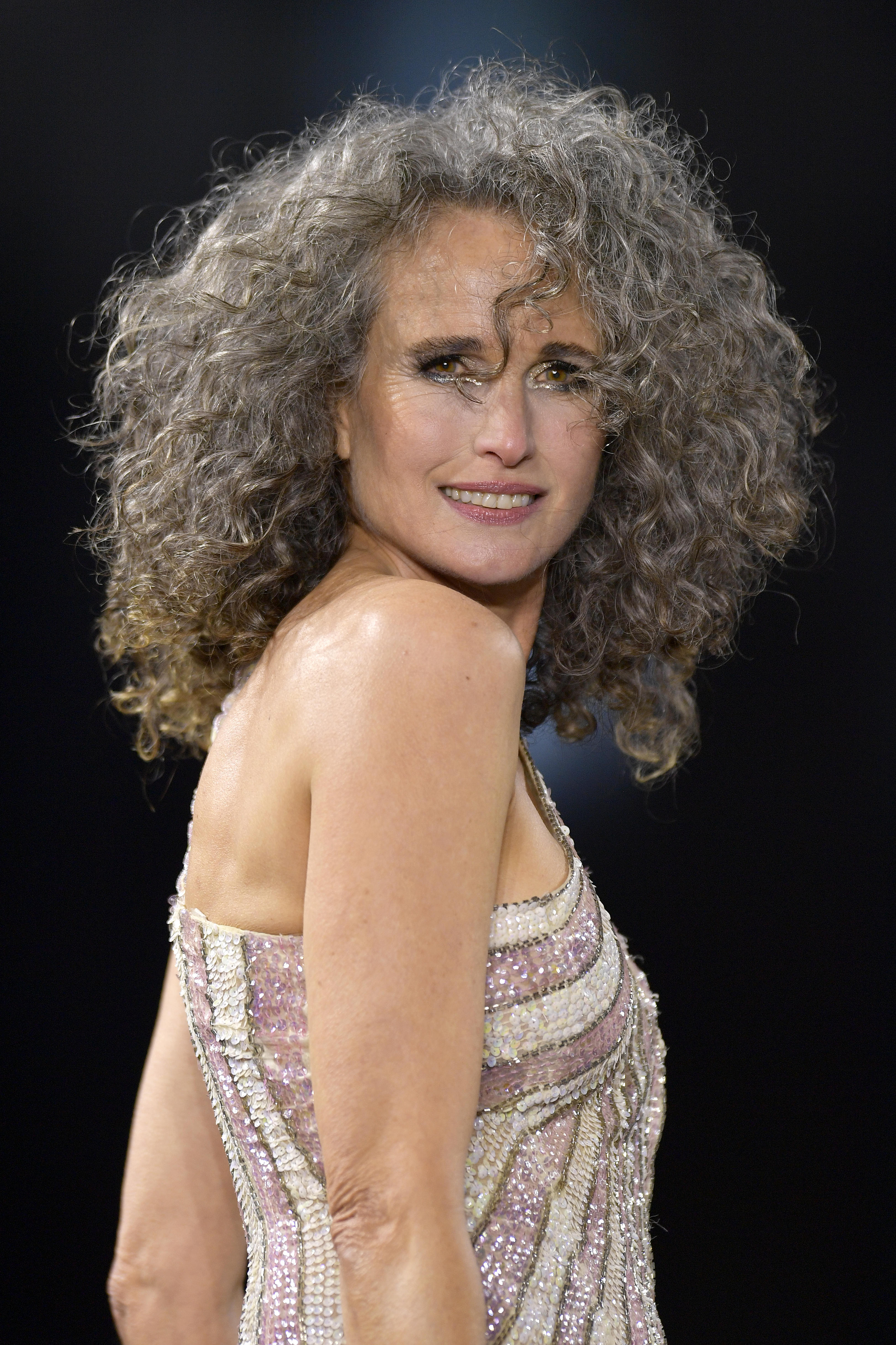 Andie MacDowell walks the runway during the "Le Defile Walk Your Worth" By L'Oreal Paris Womenswear Spring/Summer show as part of Paris Fashion Week on October 2, 2022, in Paris, France | Source: Getty Images