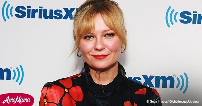 Kirsten Dunst shows off her baby bump in loose-fitting red dress during a recent appearance
