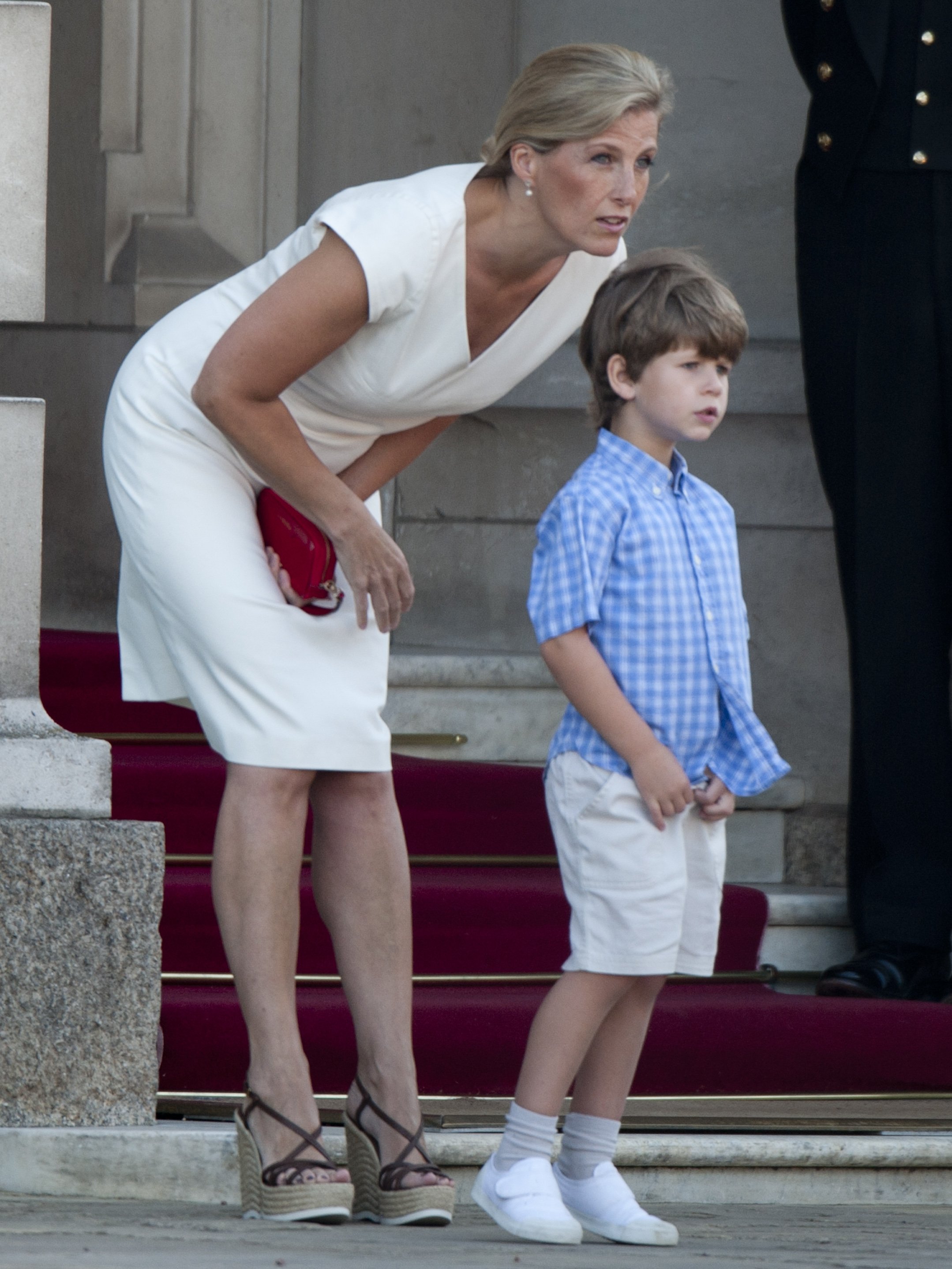 Sophie, Countess of Wessex, and her son, James, Viscount Severn watch The London 2012 Olympic Torch Relay on July 26, 2012, at Buckingham Palace, London. | Source: Getty Images