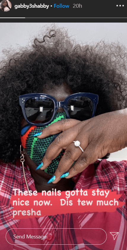 Gabby Sidibe shares a selfie of herself wearing a facemask and flaunting her engagement ring. | Photo: Instagram/Gabby3shabby