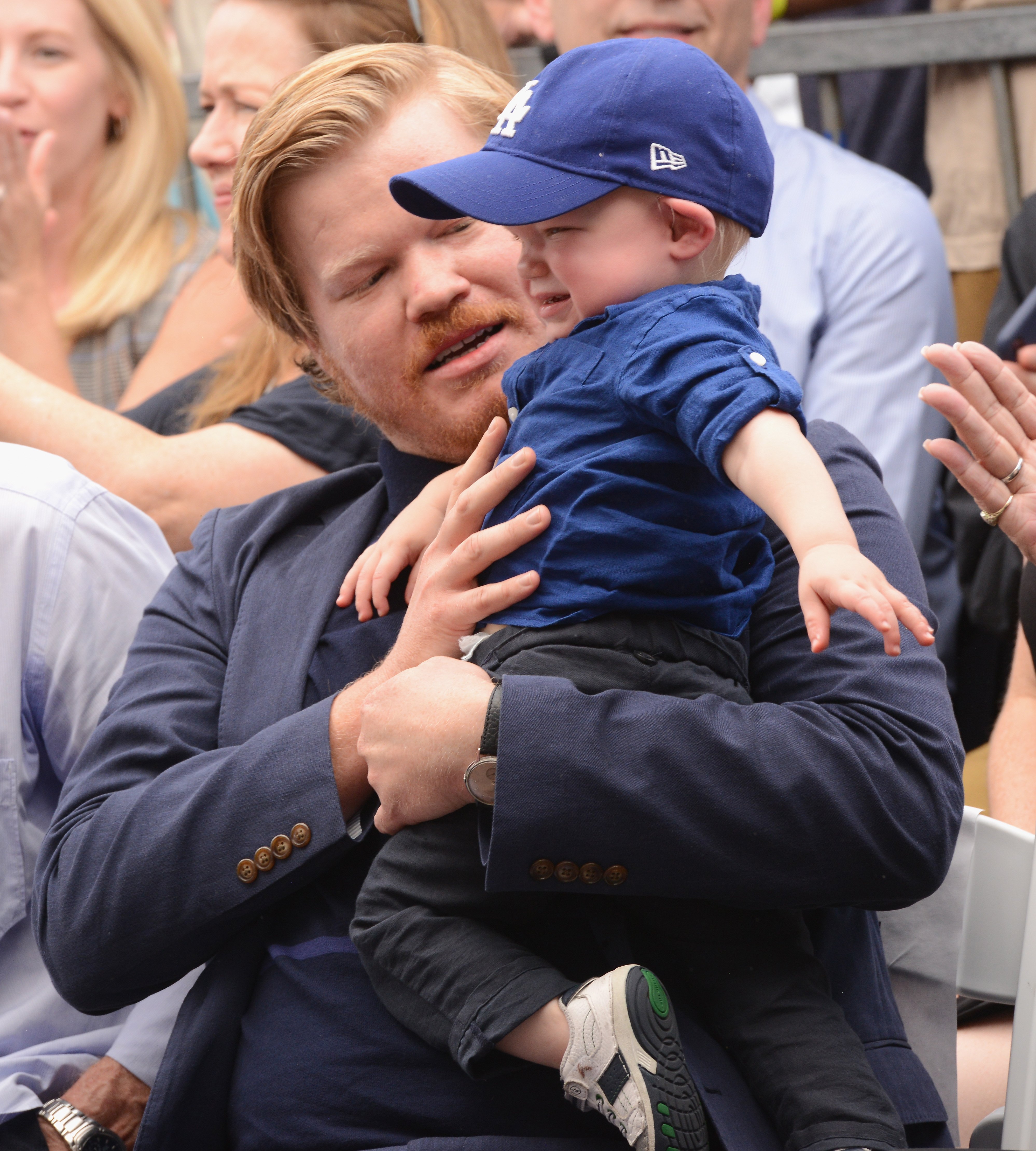 Ennis Howard Plemons stylishly dressed with his father as Kirsten Dunst receives her star on the Hollywood Walk of Fame on August 29, 2019 | Source: Getty Images