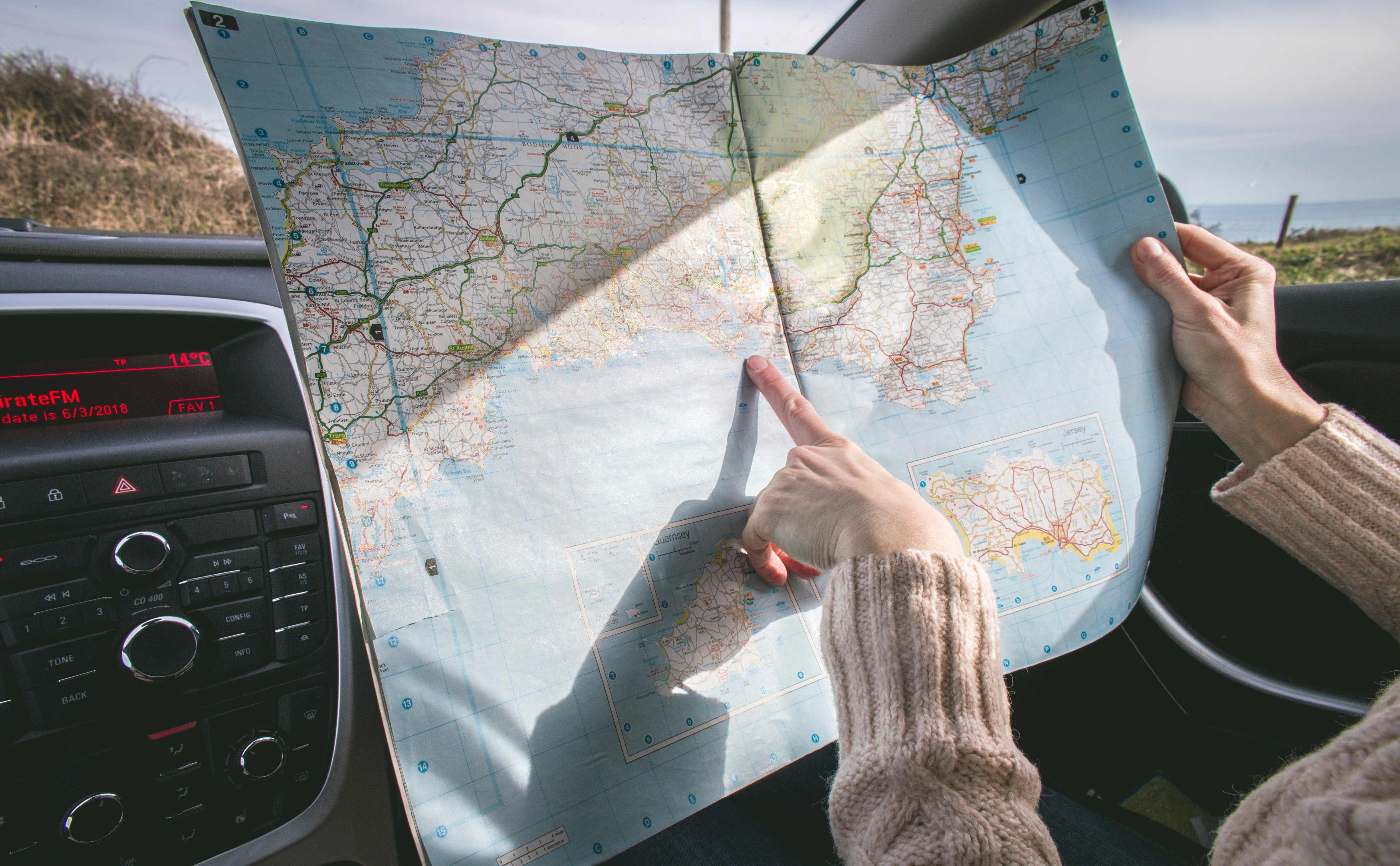 A person looking at a map | source: Pexels.com