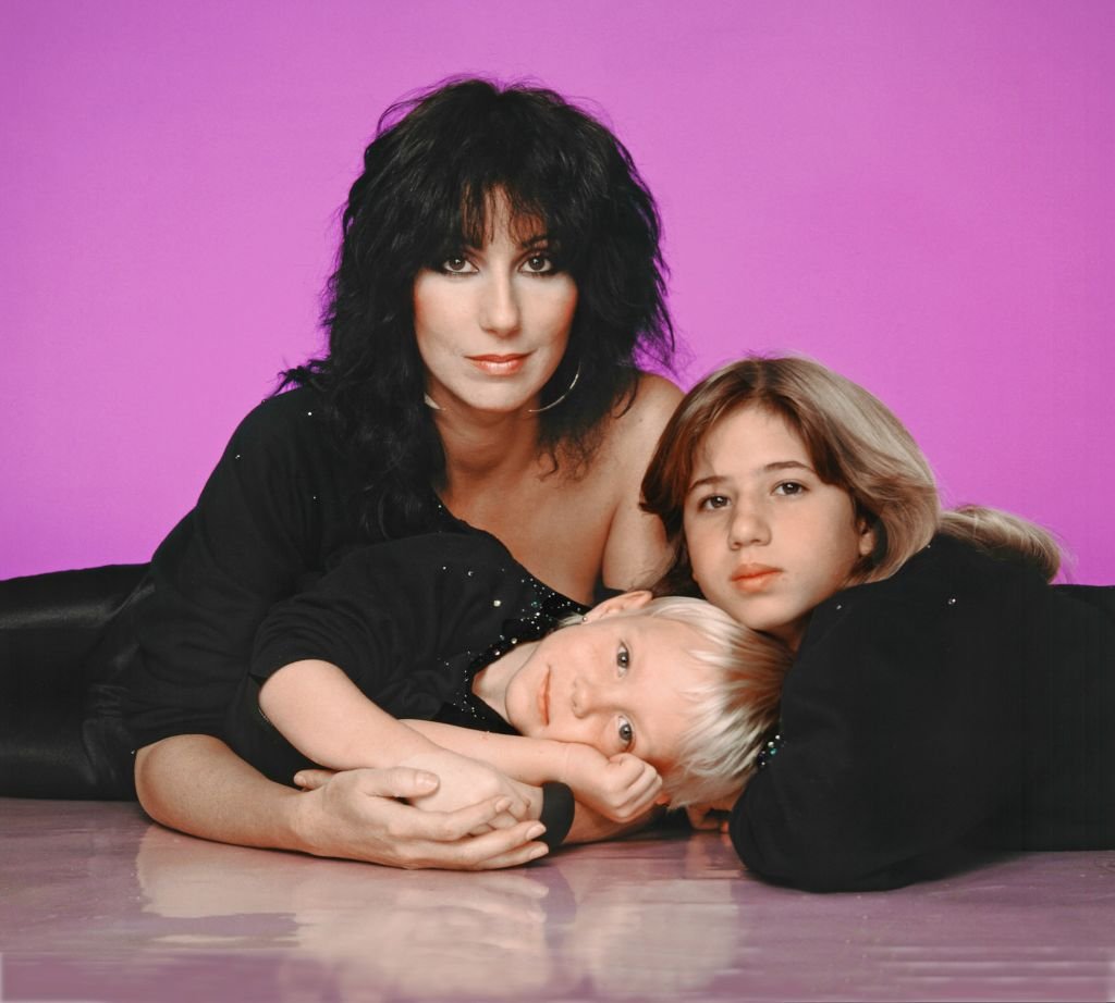 Cher with children Chaz Bono and Elijah Blue Allman posing for a portrait in 1980 in Los Angeles | Photo: Getty Images