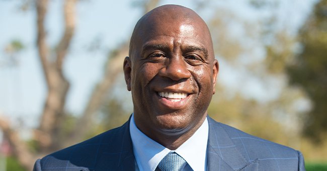 Magic Johnson smiling for a picture | Photo: Getty Images