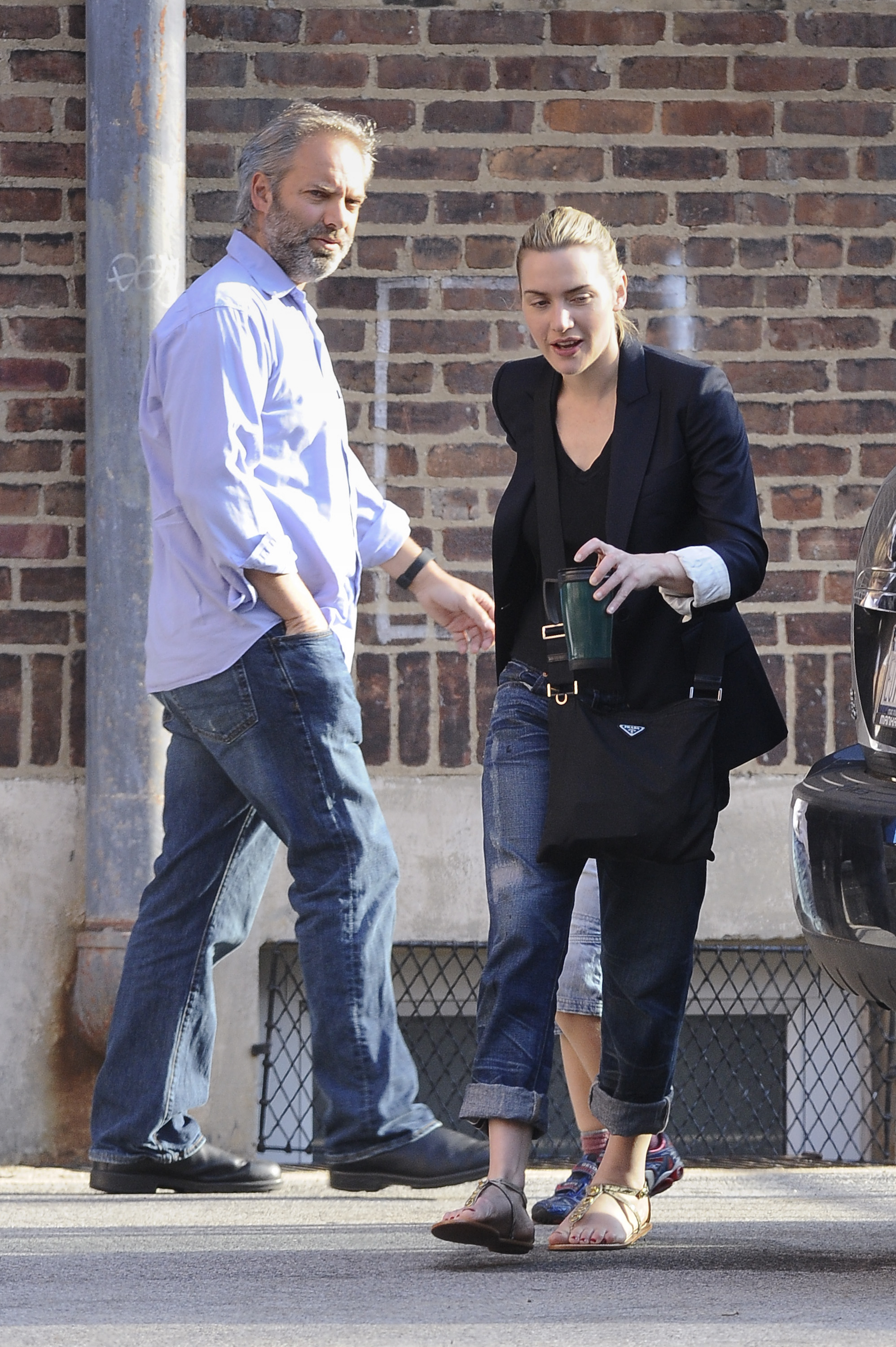 Sam Mendes and Kate Winslet were photographed walking their son, Joe Alfie Winslet Mendes, to school in New York on April 7, 2010. Their son, then just five years old, can be seen partially hidden between them — a rare public moment from a family that largely stayed out of the spotlight during that time.