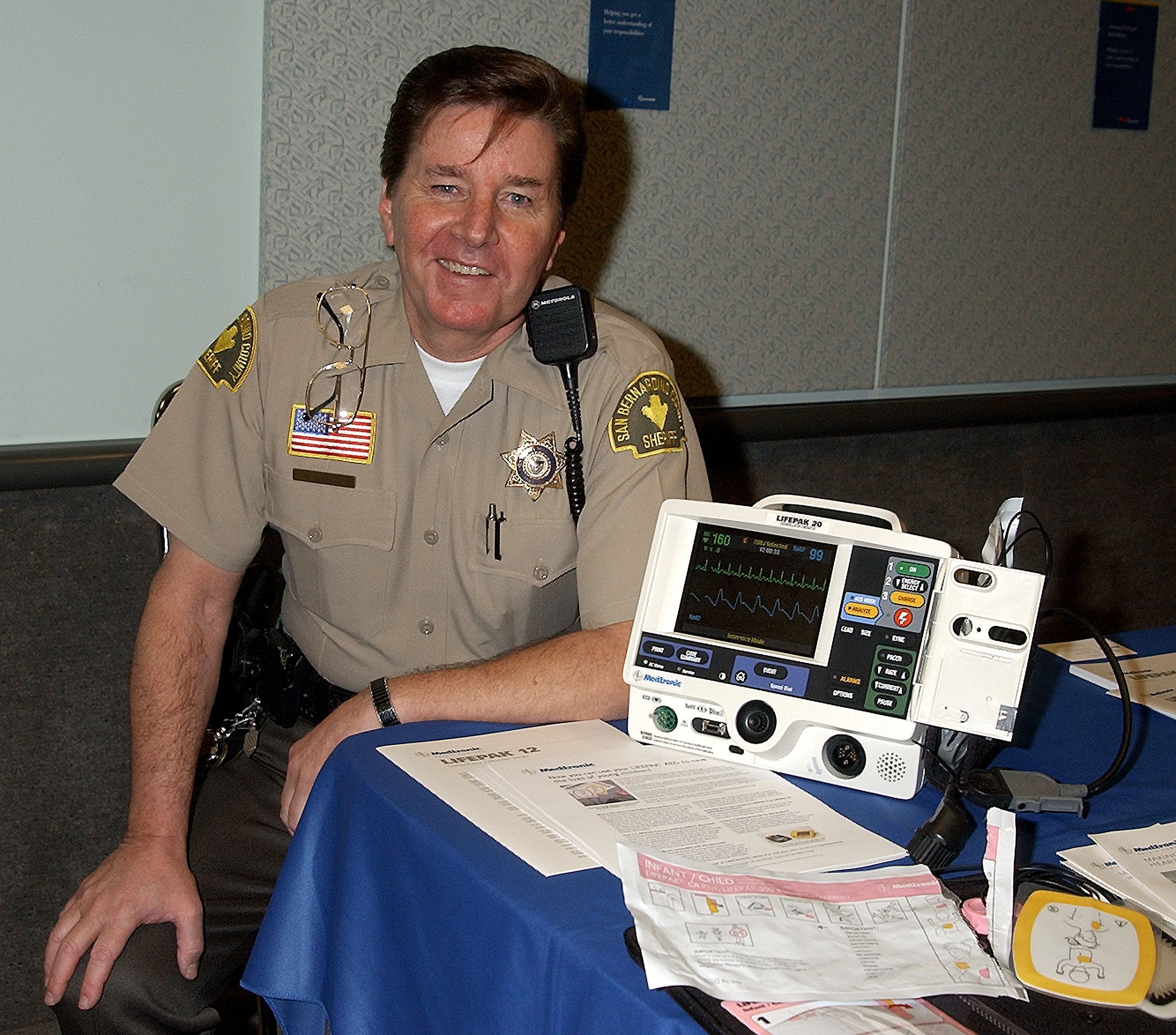 Musician turned EMT Bobby Sherman posing next to a Life Pak 20 Defibrillator / Monitor. / Source: Getty Images