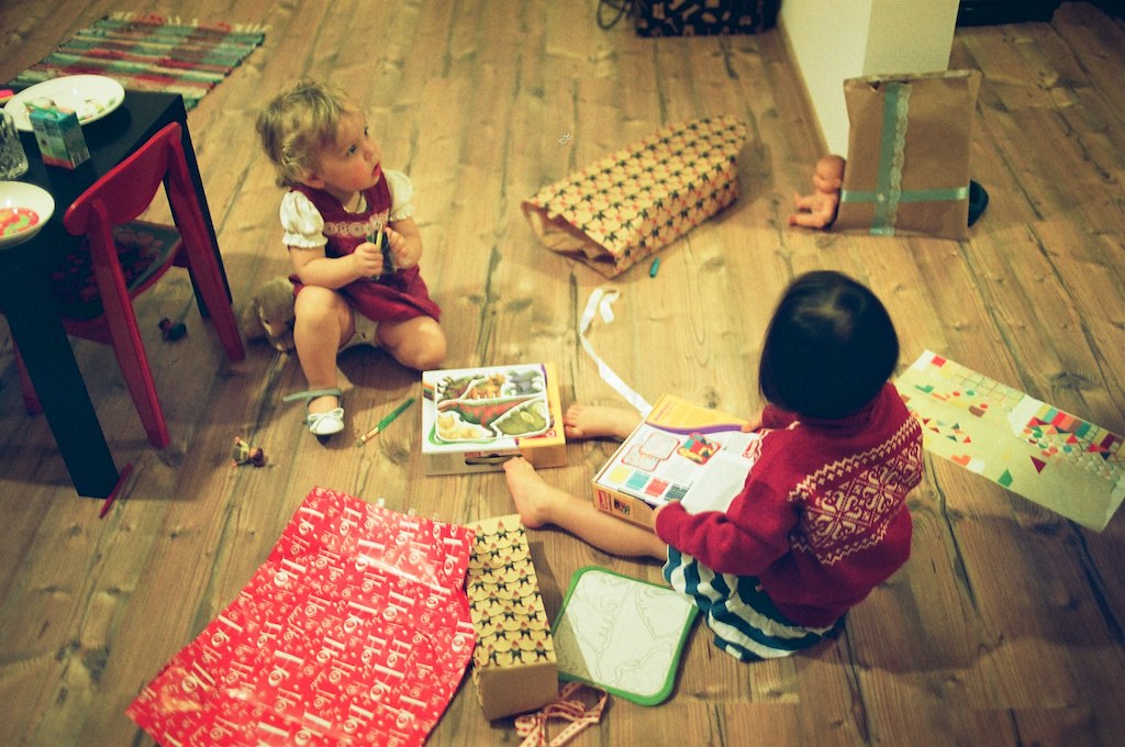 Kids opening gifts | Source: Shutterstock
