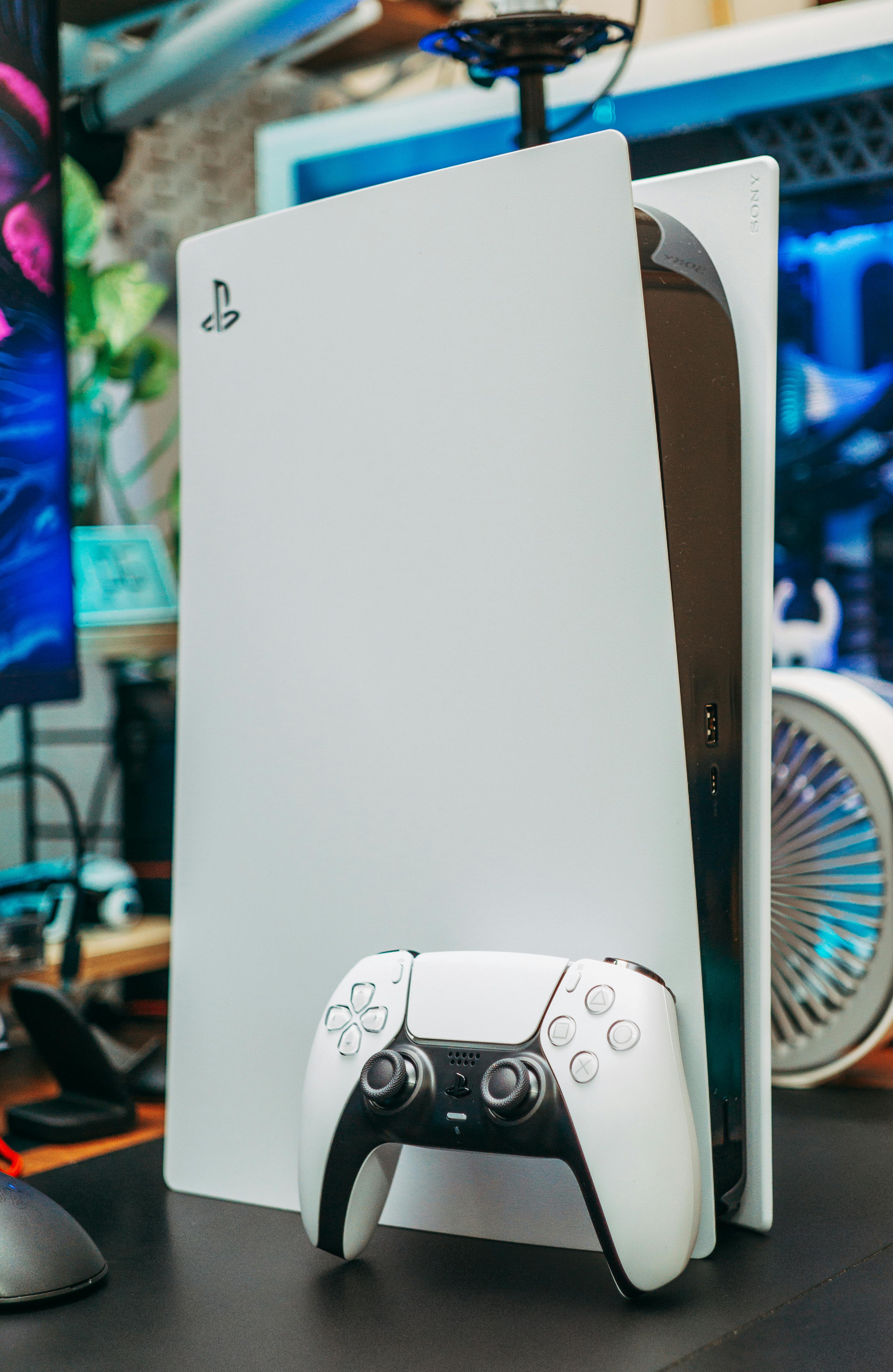 A PlayStation console and controller | Source: Pexels