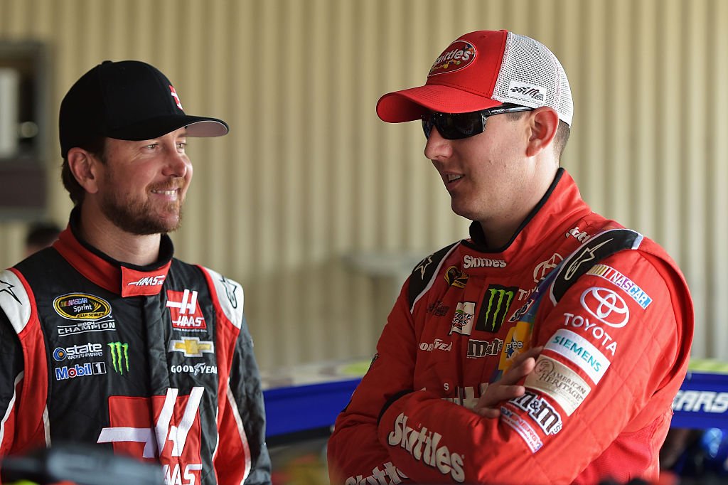 Kurt Busch and Kyle Busch in the garage area during practice for the NASCAR Sprint Cup Series FedEx 400 Benefiting Autism Speaks at Dover International Speedway on May 30, 2015. | Photo: Getty Images