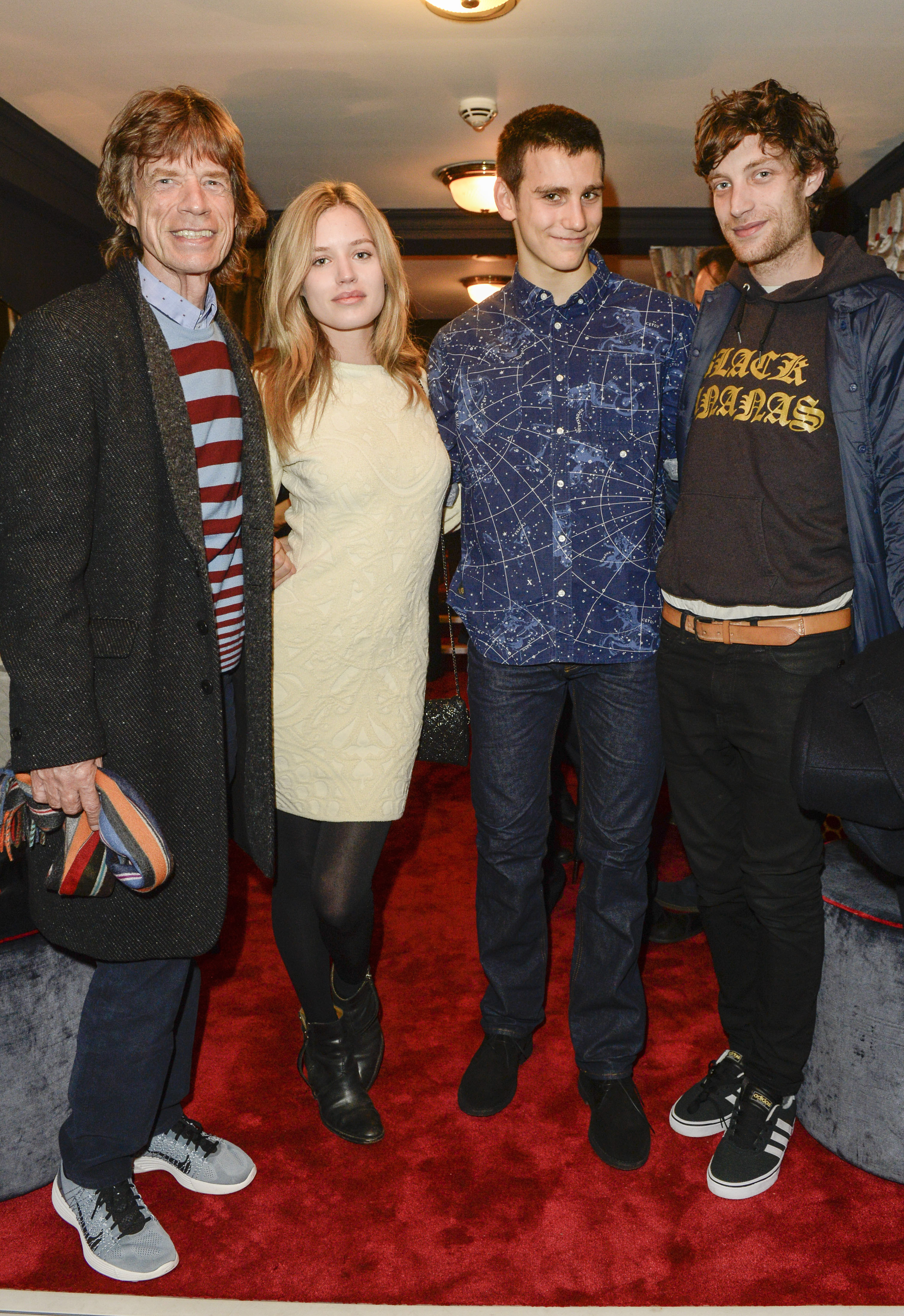 Sir Mick Jagger, Georgia May Jagger, Gabriel Jagger and James Jagger attend the press night performance of "Snow White And The Seven Dwarfs" at the Richmond Theatre on December 11, 2014 in Richmond, England | Source: Getty Images