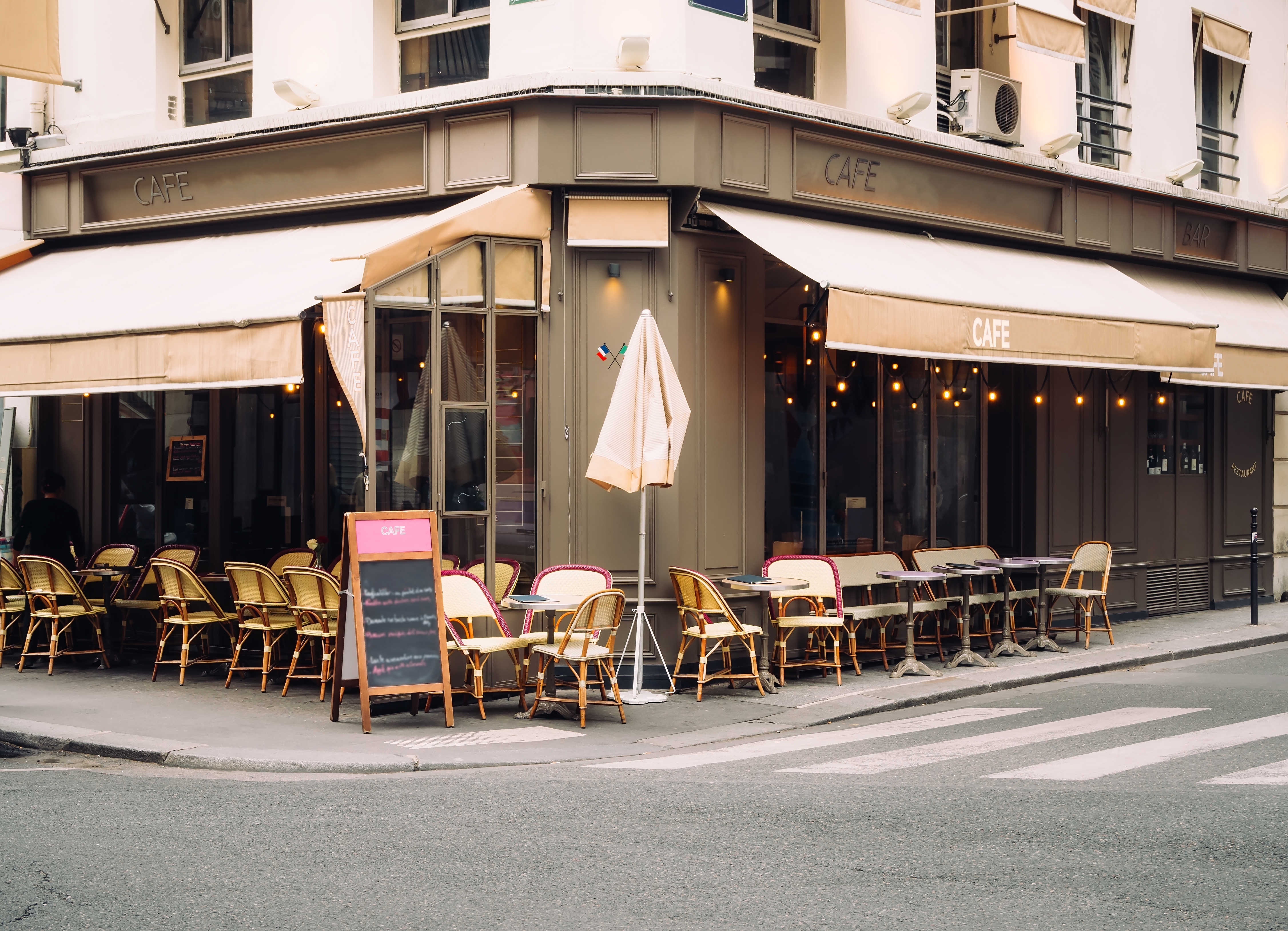 Cozy street with tables of cafe | Source: Shutterstock