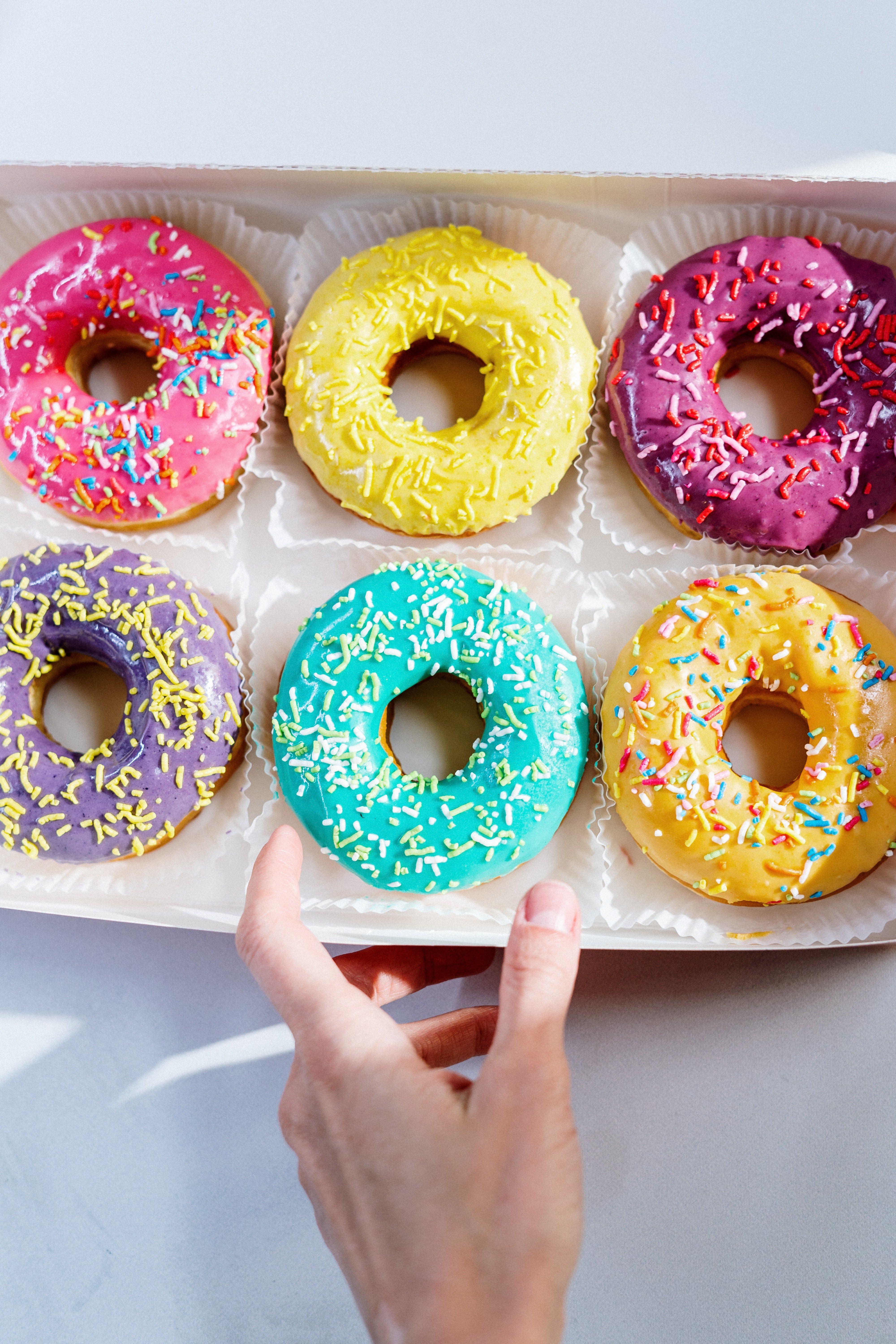 While the man was consuming a donut, I saw a dark spot on his neck. | Source: Pexel