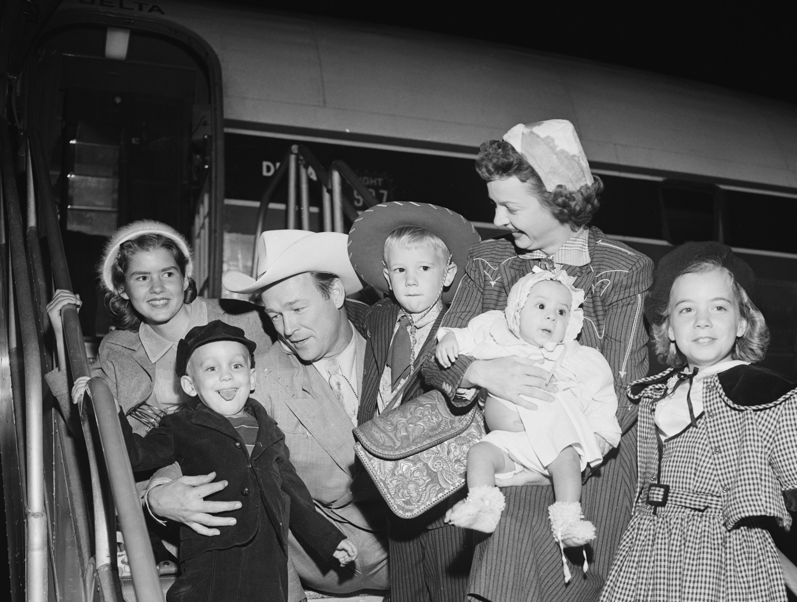  Cowboy-Actor Roy Rogers and actress wife Dale Evans arrive by plane in Los Angeles, Bringing with them two newly adopted children, five year old Sandy and five-month old Doe. | Source: Getty Images