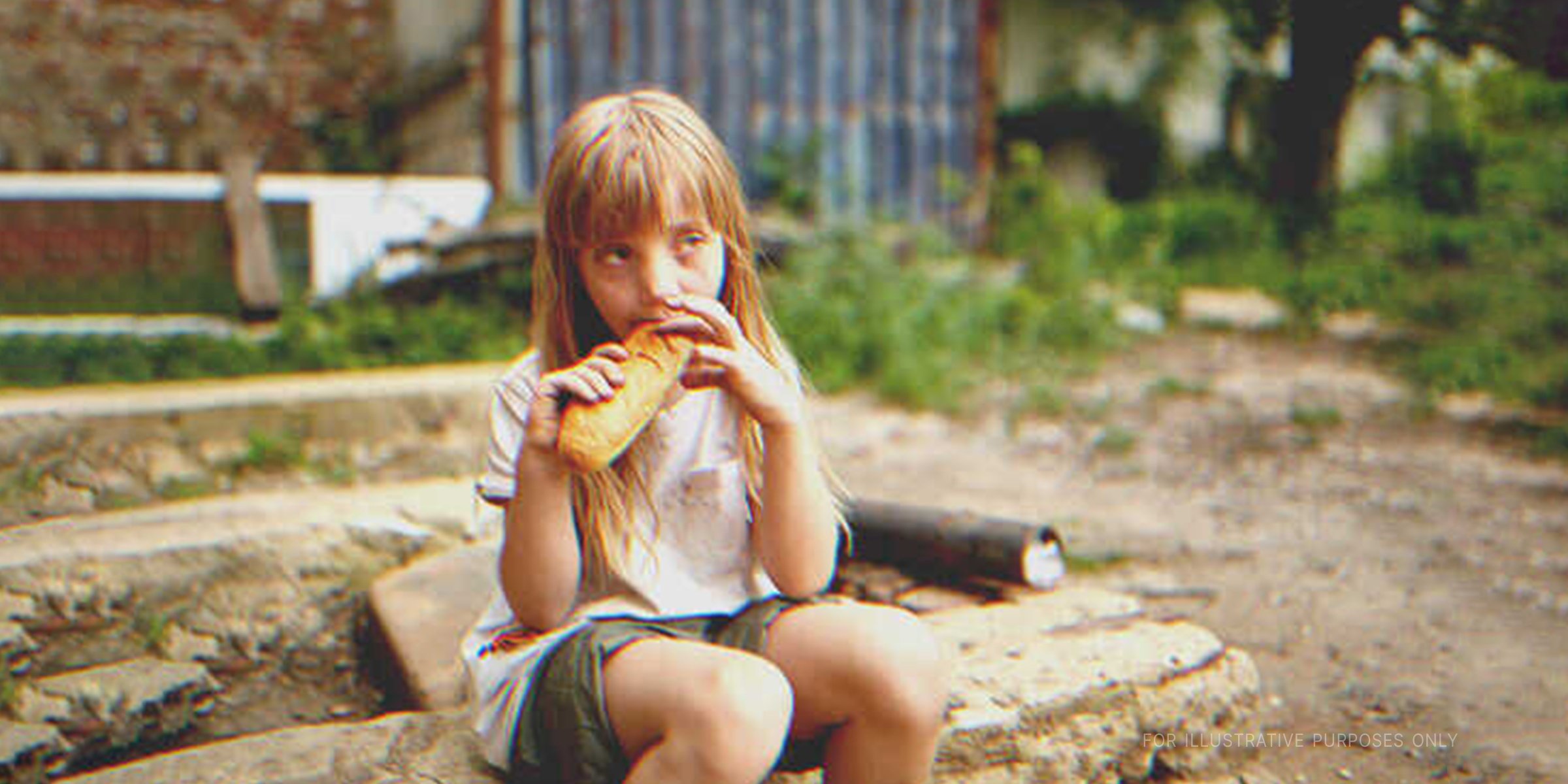 Girl eats sandwich | Source: Shutterstock