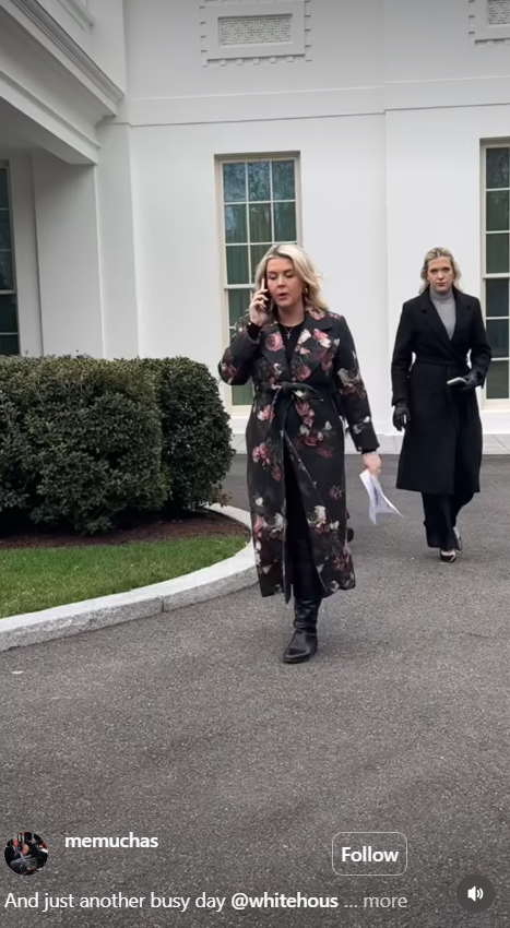 Karoline Leavitt walks across the White House grounds while taking a phone call, holding notes in hand | Source: Instagram/memuchas