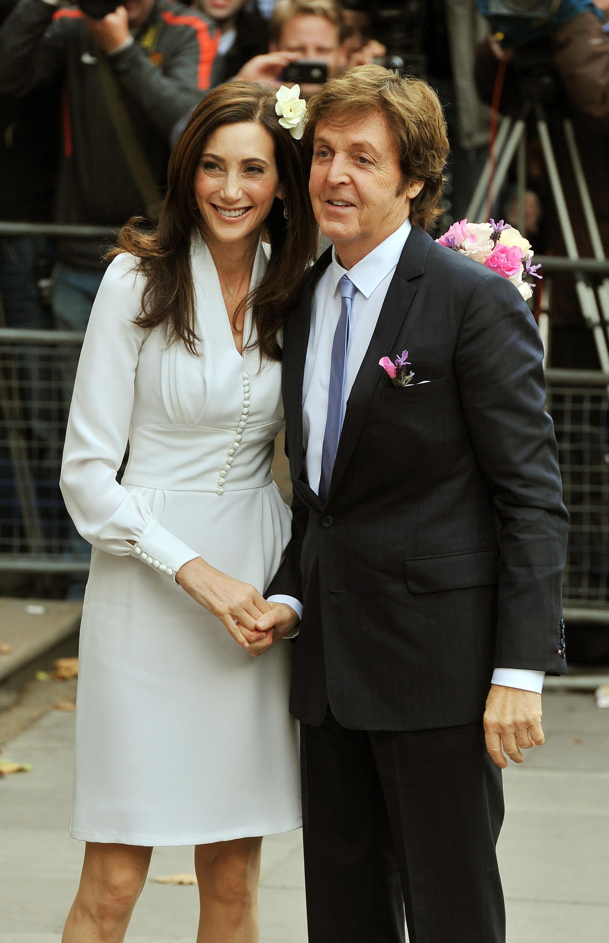Nancy Shevell with Sir Paul McCartney arrive at Westminster Registry Office in north London for their wedding. | Source: Getty Images