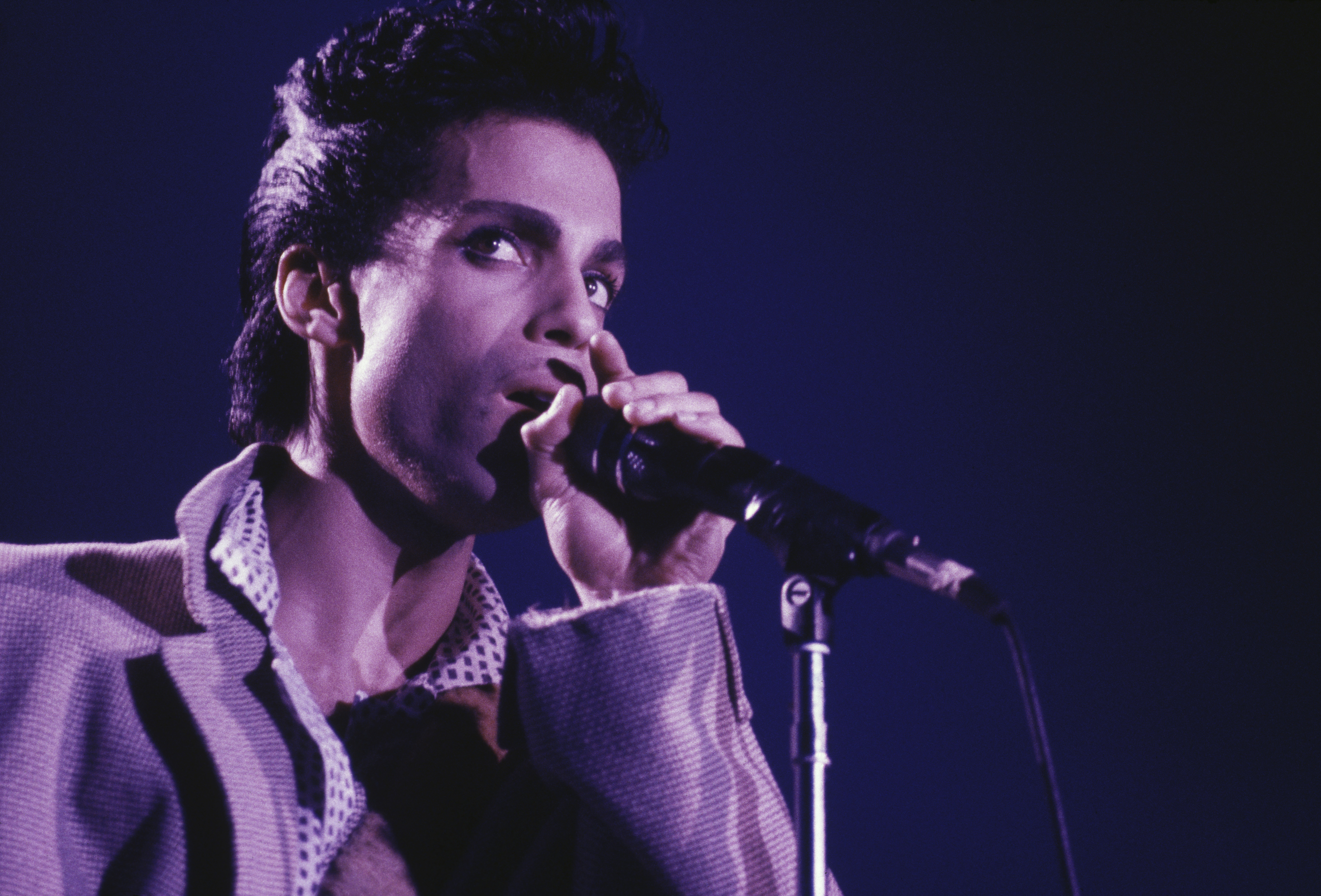 Prince performing during the Hit N Run-Parade tour in August 1986 in Wembley Arena, London | Source: Getty Images