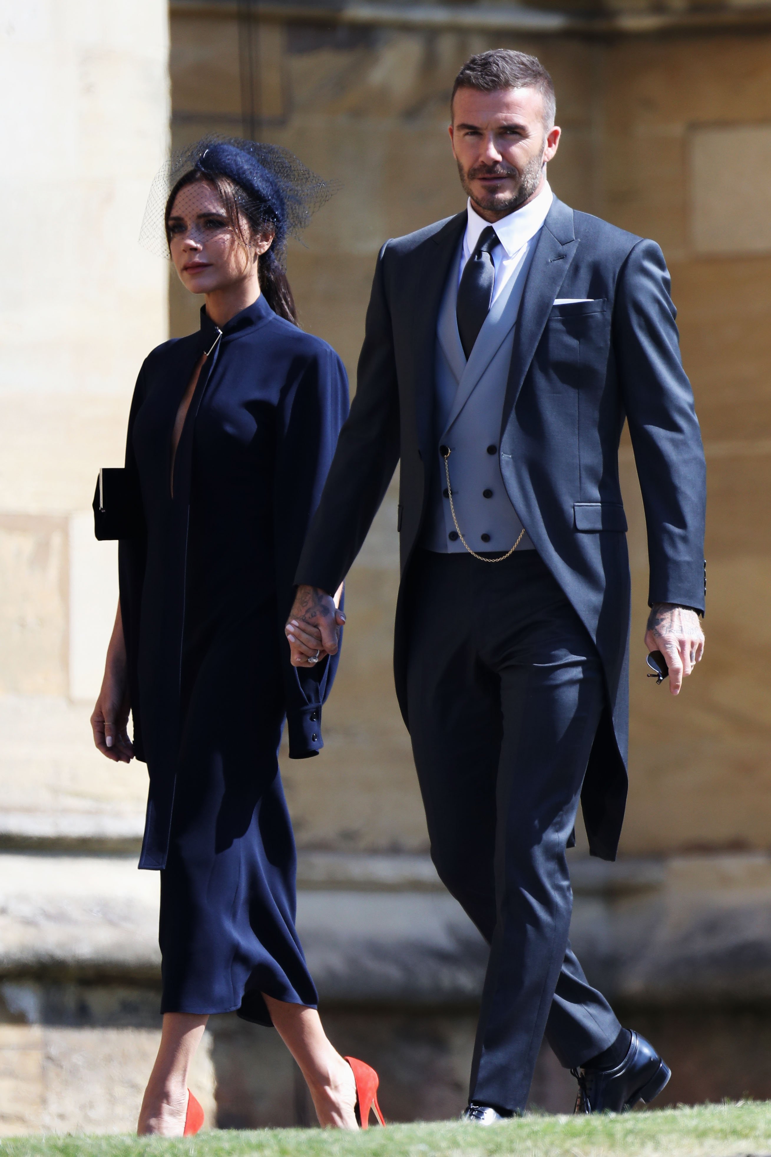 Victoria Beckham and David Beckham arrive at Prince Harry and Meghan Markle's wedding at St George's Chapel, Windsor Castle on May 19, 2018, in Windsor, England. | Source: Getty Images.