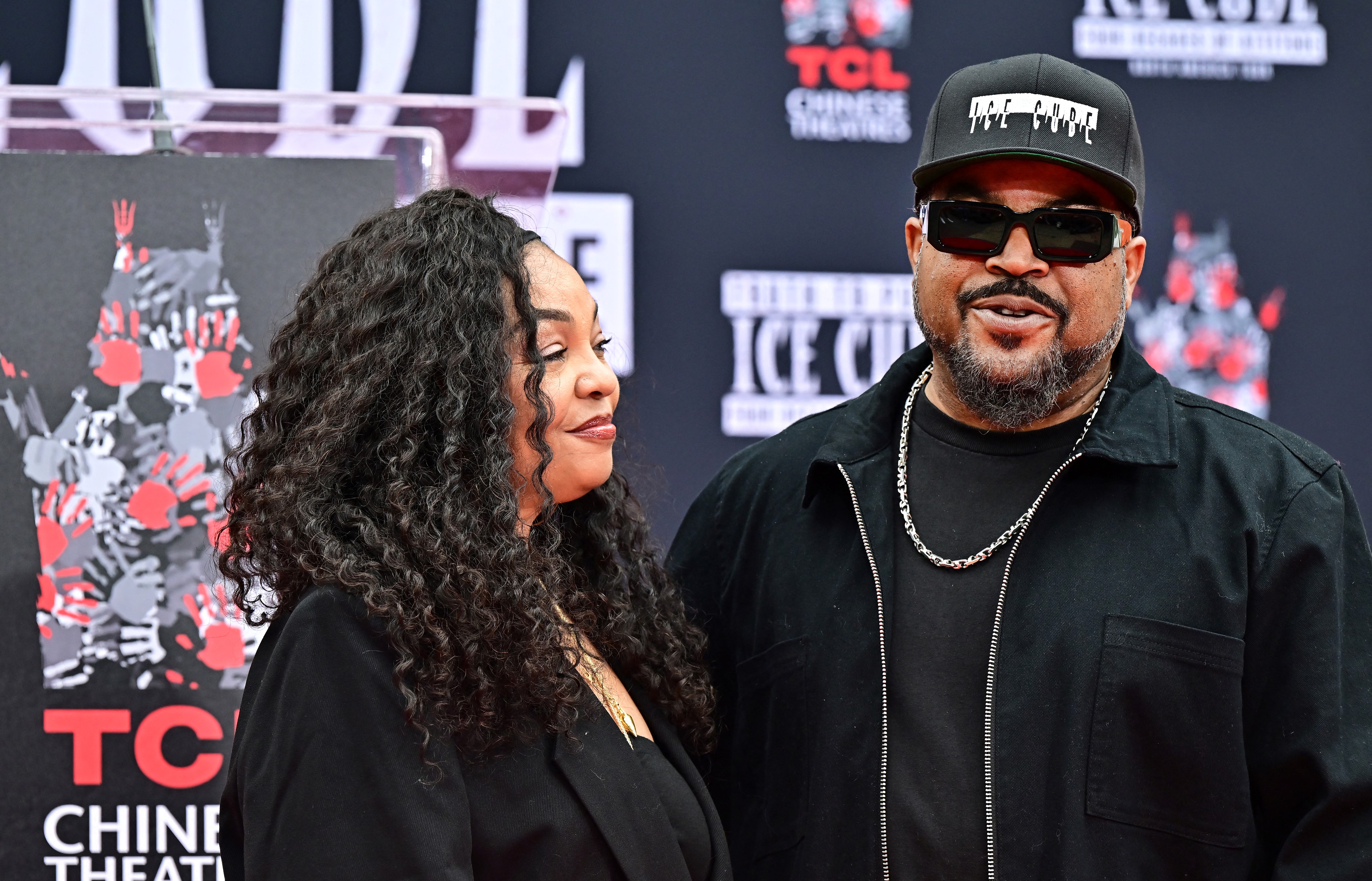 Kimberly Woodruff and Ice Cube at Ice Cube's hand and footprint ceremony in Hollywood, California on April 15, 2025. | Source: Getty Images