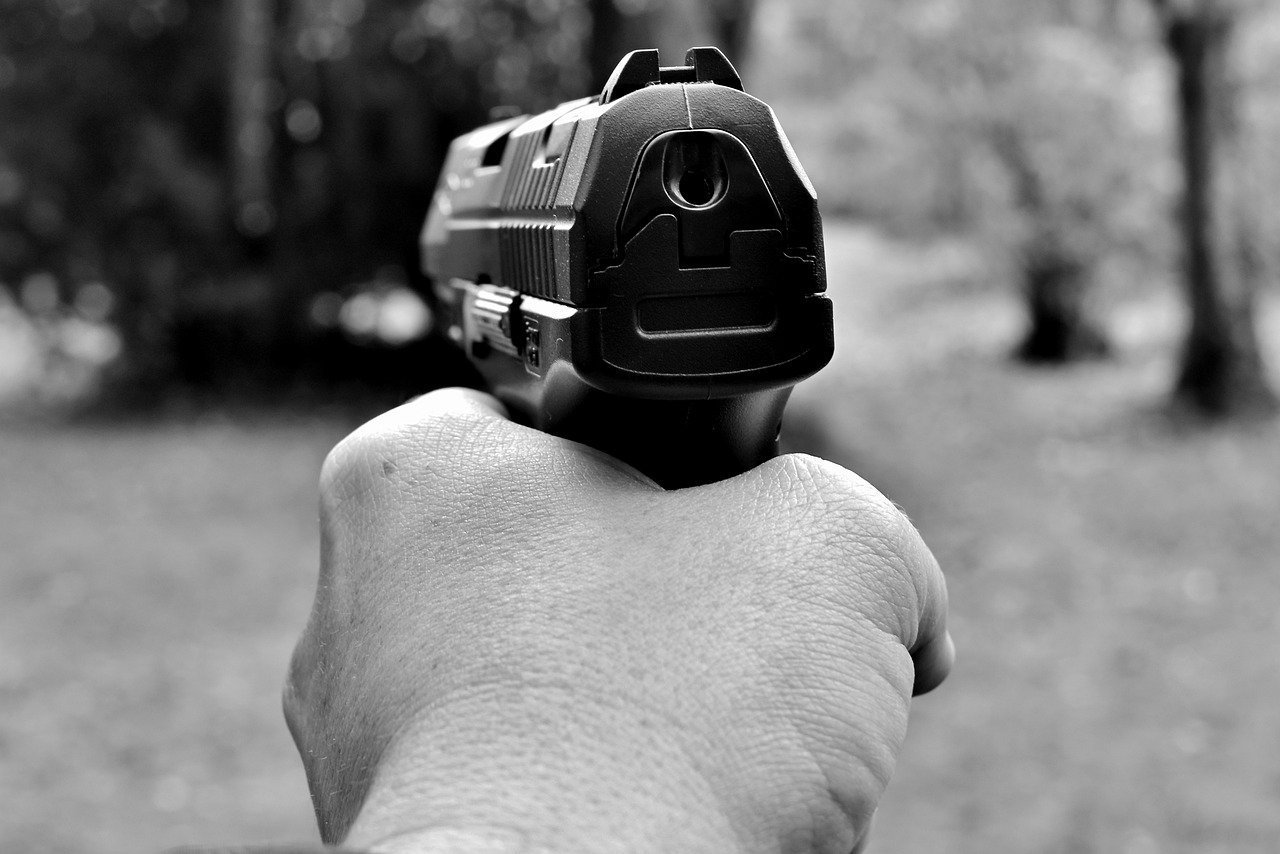 Man pointing a gun. Image credit: Pixabay