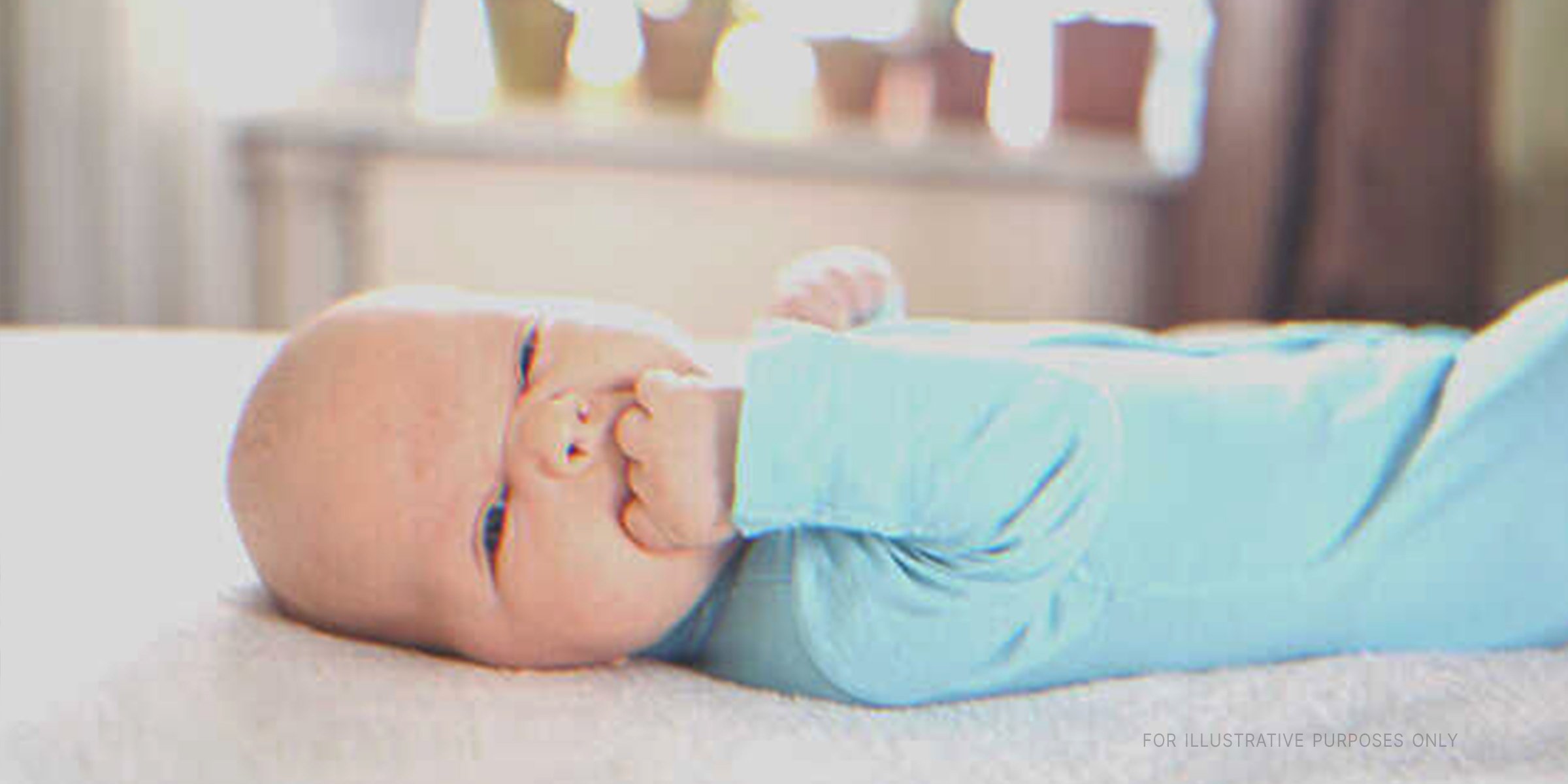 Baby on bed | Shutterstock