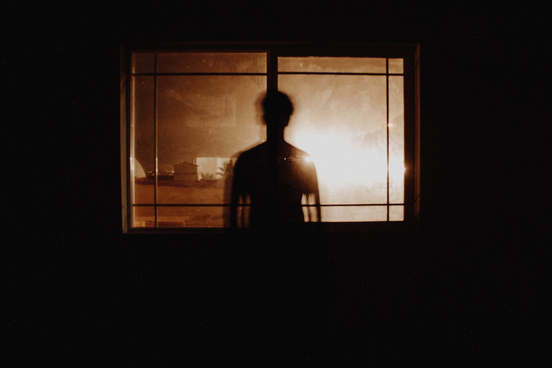 They saw a dark figure in the room. | Source: Unsplash