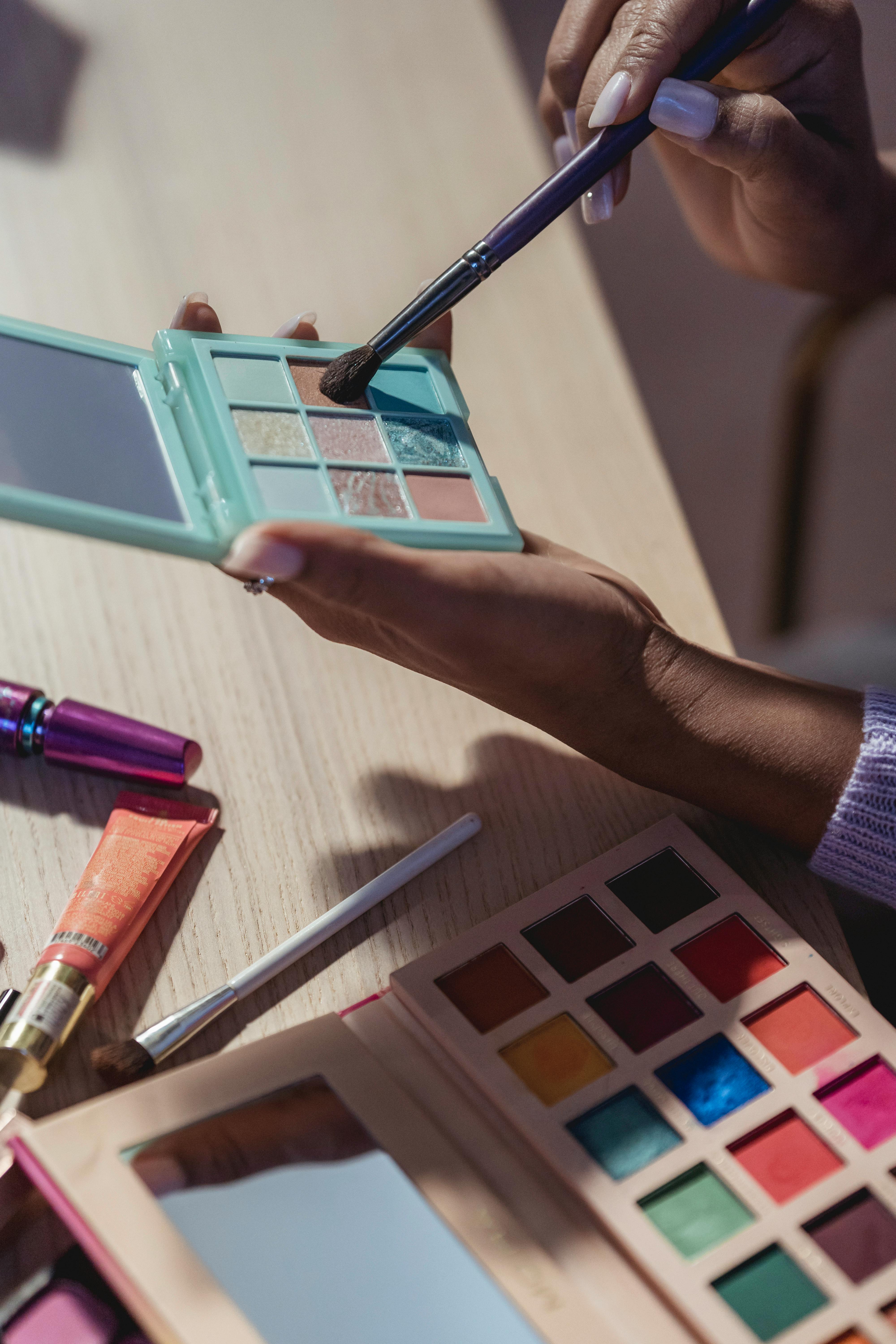 For illustration purposes only. Makeup artist selects the product she wants to use | Source: Pexels