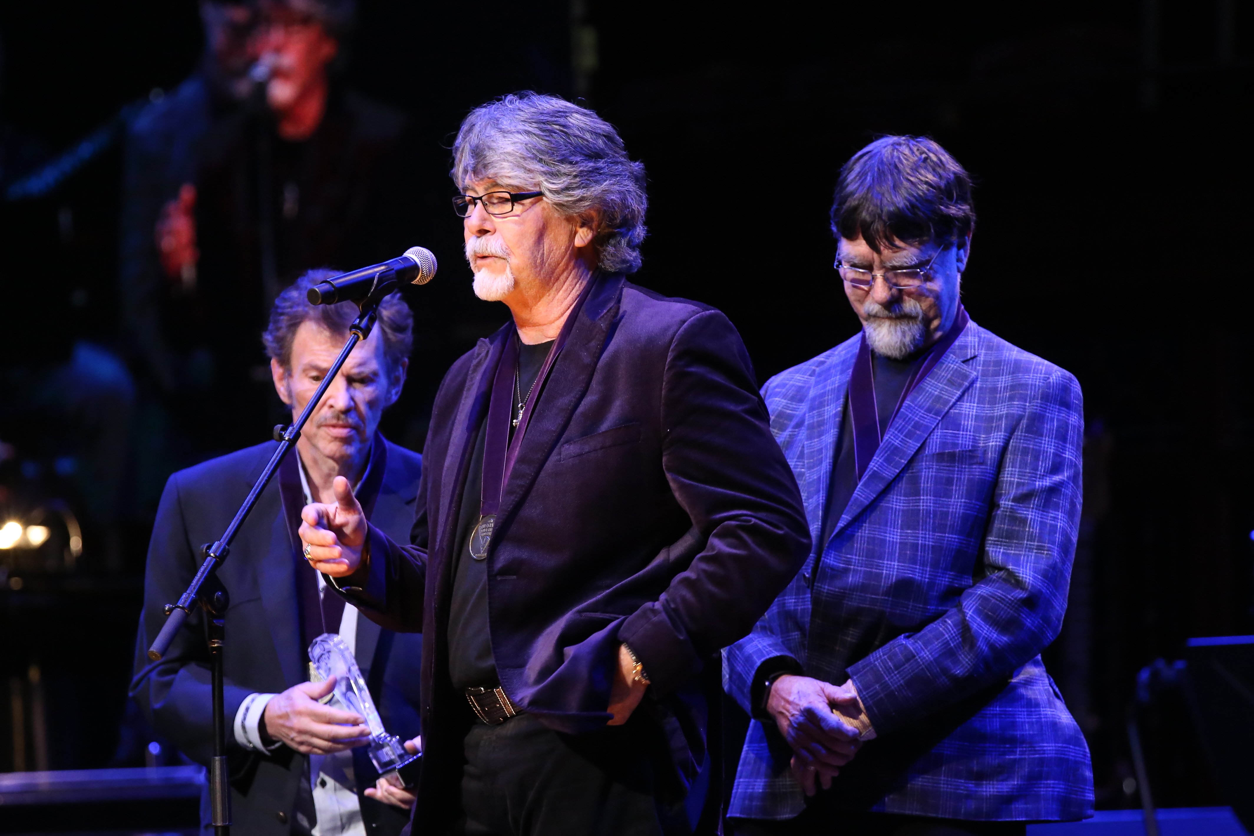 |Jeff Cook, Randy Owen and Teddy Gentry of Alabama speak onstage during the 2019 Musicians Hall of Fame Induction Ceremony & Concert at Schermerhorn Symphony Center on October 22, 2019 in Nashville, Tennessee | Source: Getty Images 