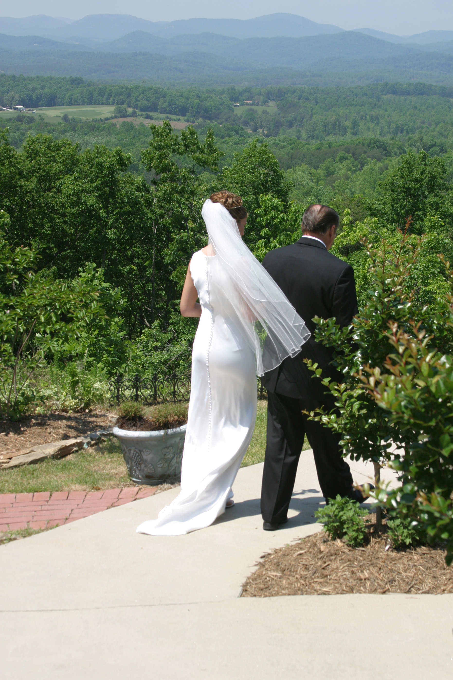 A man walks down the aisle with a bride. | Source: Shutterstock