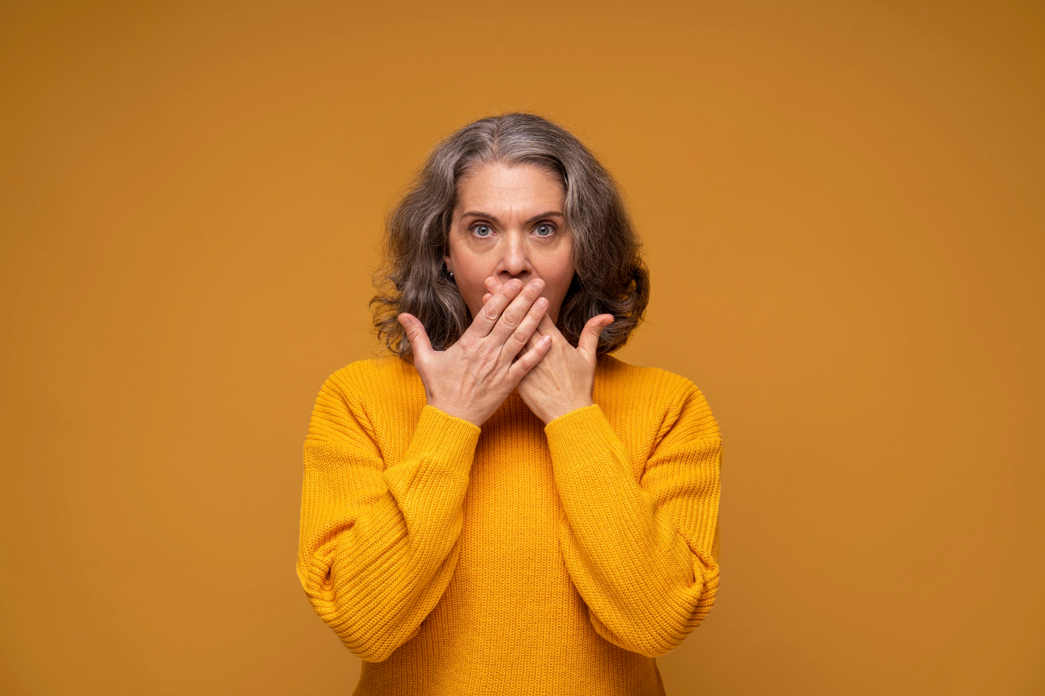 A stunned senior woman | Source: Freepik