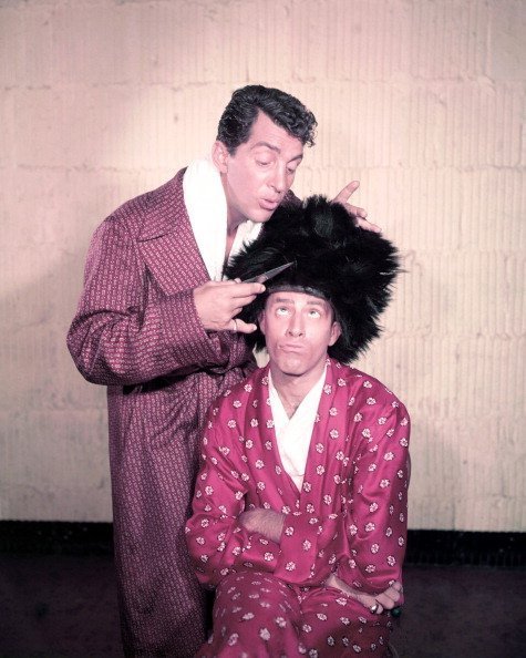 Dean Martin and Jerry Lewis wearing dressing gowns in a studio portrait in 1950. | Photo: Getty Images