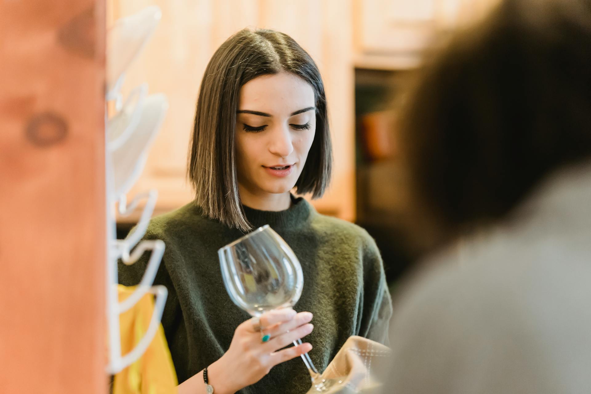 A woman holding a glass | Source: Pexels
