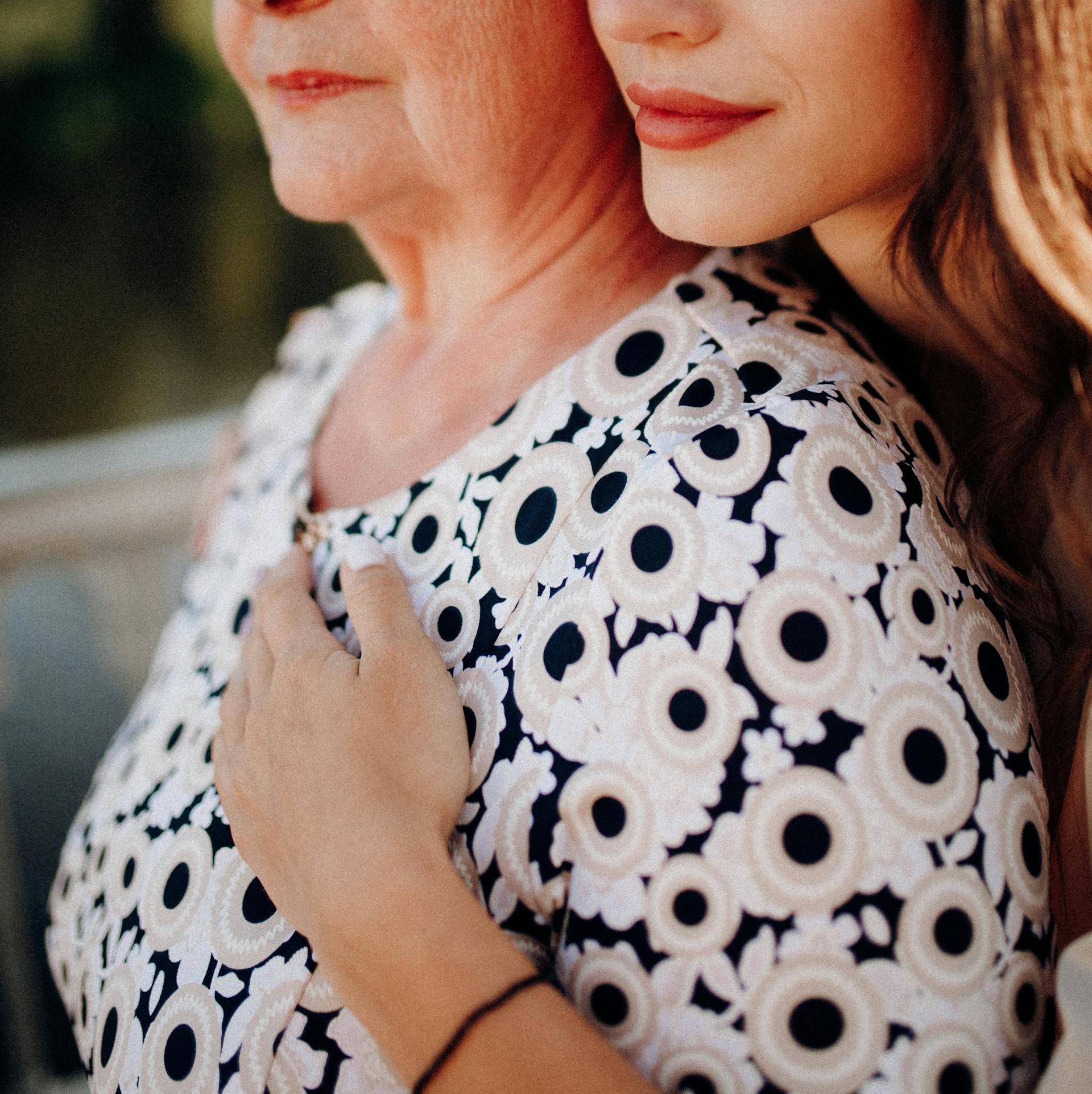 A young woman embracing a senior woman | Source: Pexels