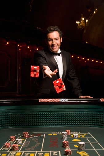 Photo of a man throwing dice in a casino | Photo: Getty Images