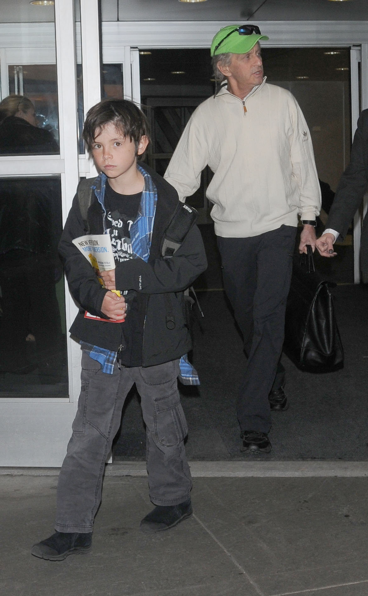 Michael Douglas and son Dylan Douglas as seen at JFK airport on December 31, 2010 in New York City | Source: Getty Images