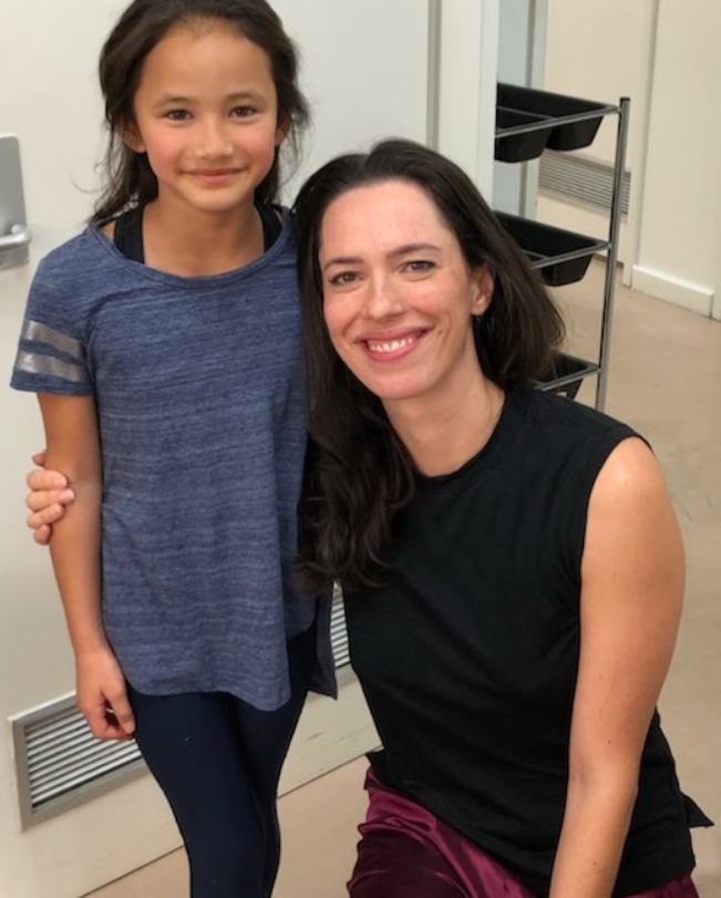 Kaylee Hottle and Rebecca Hall smile together in a behind-the-scenes photo shared by Rebecca following Kaylee's death. Rebecca posted several images from their time working together on the "Godzilla" films as part of her tribute. | Source: Instagram/rebeccahall