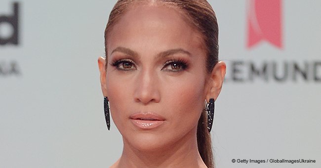 Jennifer Lopez shows off her tiny figure and muscular legs in red mini dress