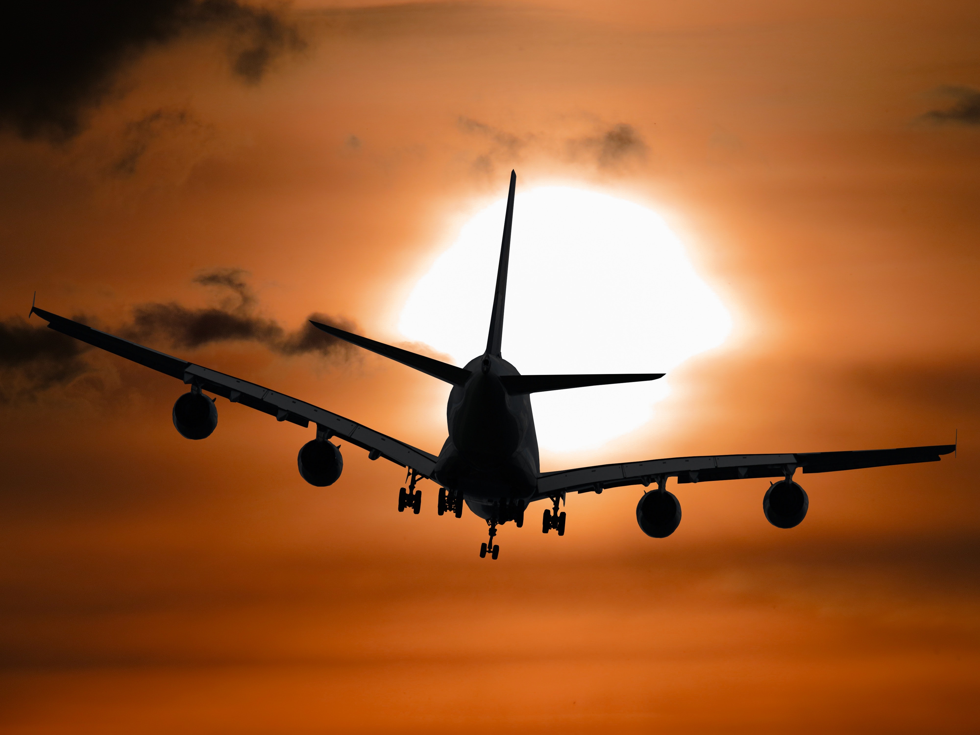 Plane flying during sunset | Source: Pexels