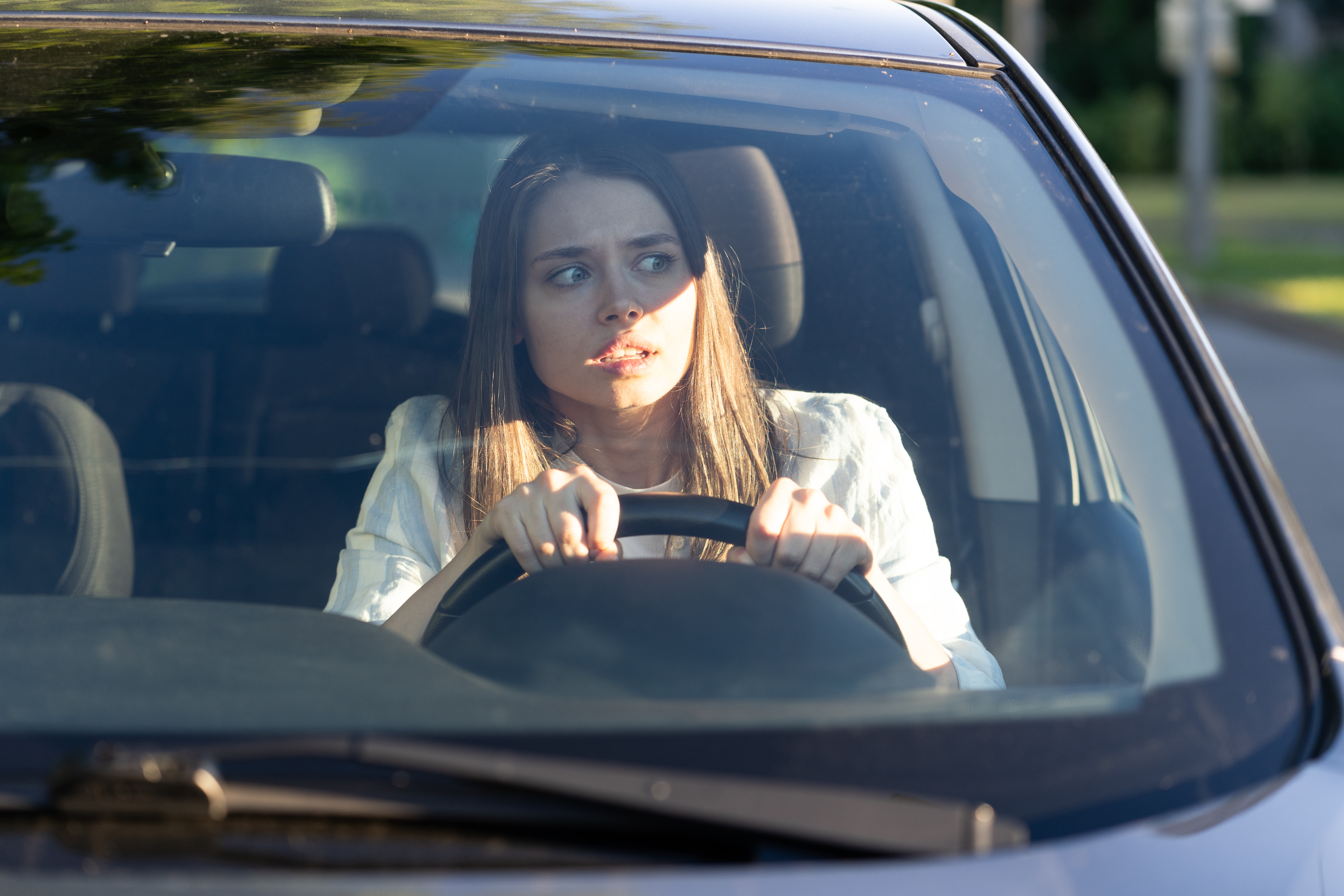 Woman drives her car | Source: Shutterstock