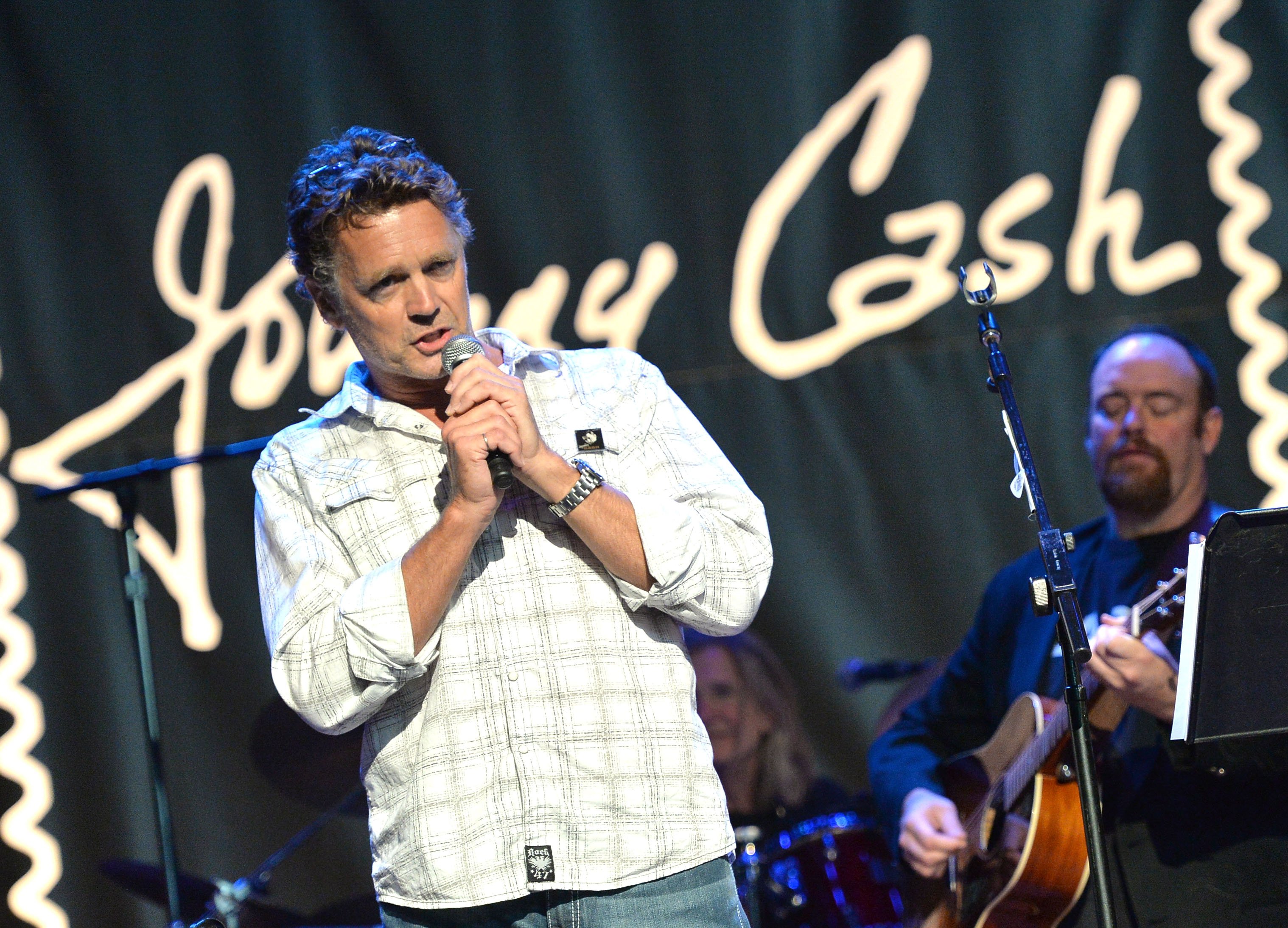  John Schneider and John Carter Cash perform at the Johnny Cash Limited-Edition Forever Stamp launch at Ryman Auditorium on June 5, 2013  | Photo: GettyImages