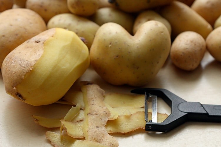 A photo of potatoes being peeled | Photo: Unsplash