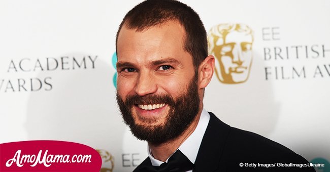  ‘Fifty Shades’ star holds his 4-year-old daughter in his arms. He looks like such a proud dad