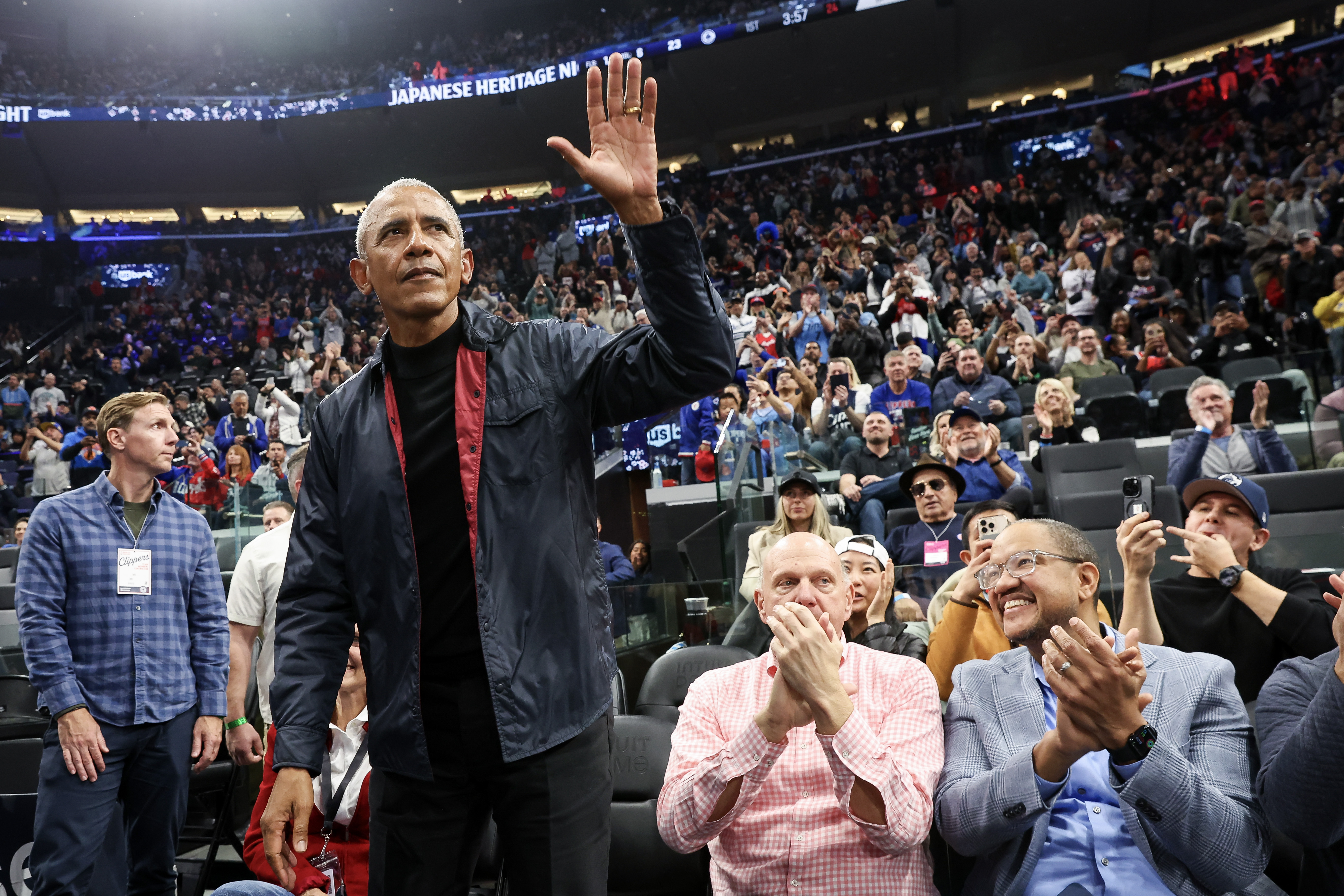 Barack Obama waves at spectators during a basketball game on March 5, 2025, in Inglewood, California. | Source: Getty Images