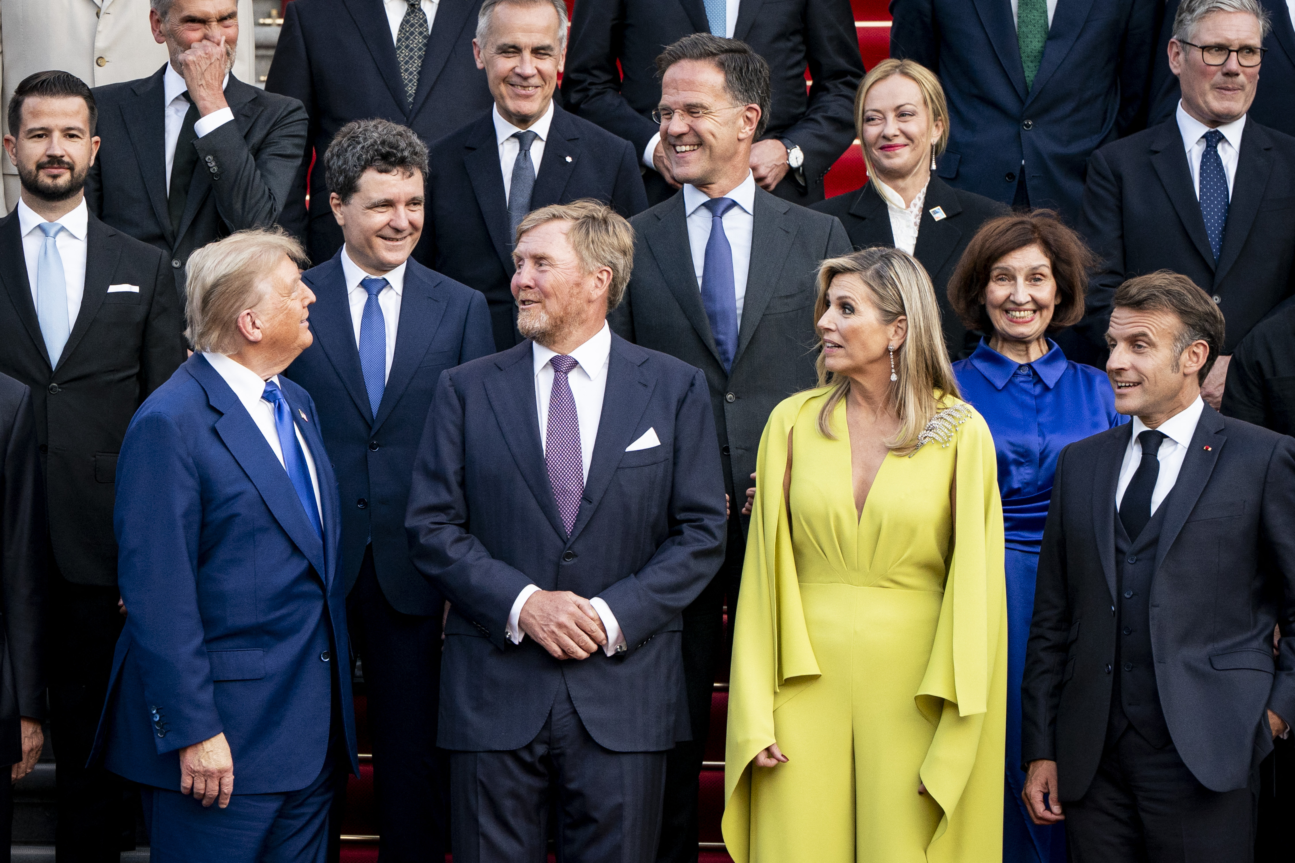 At the social dinner, they pose for a family photo, with most eyes on Trump as they appear to laugh at a light moment he shared. He stands alongside France's President Emmanuel Macron, NATO Secretary General Mark Rutte, King Willem-Alexander, and Queen Máxima.
