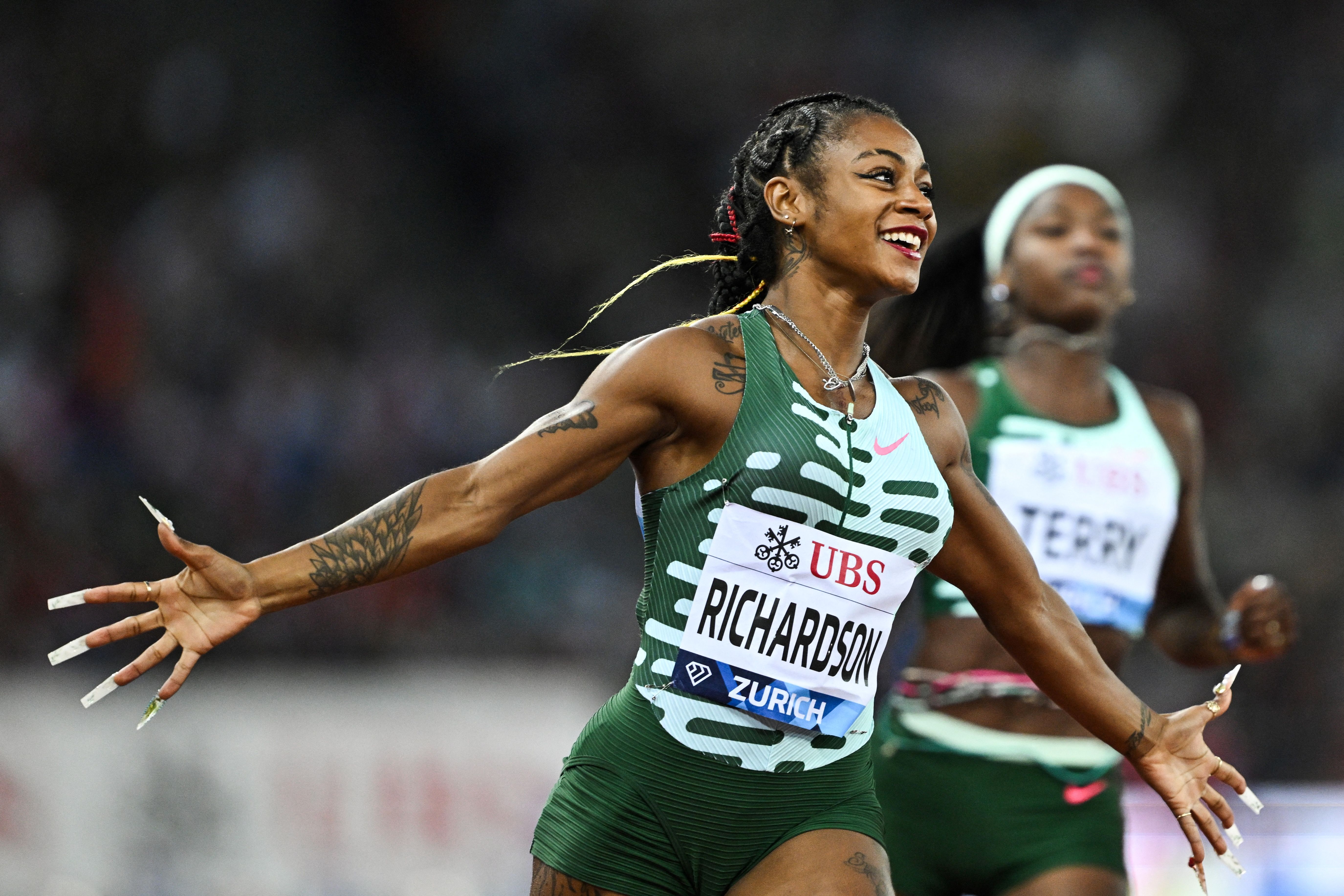 Sha'Carri Richardson celebrating crossing the finish line to win the Women's 100-meter Final during the Diamond League athletics meeting on August 31, 2023. | Source: Getty Images