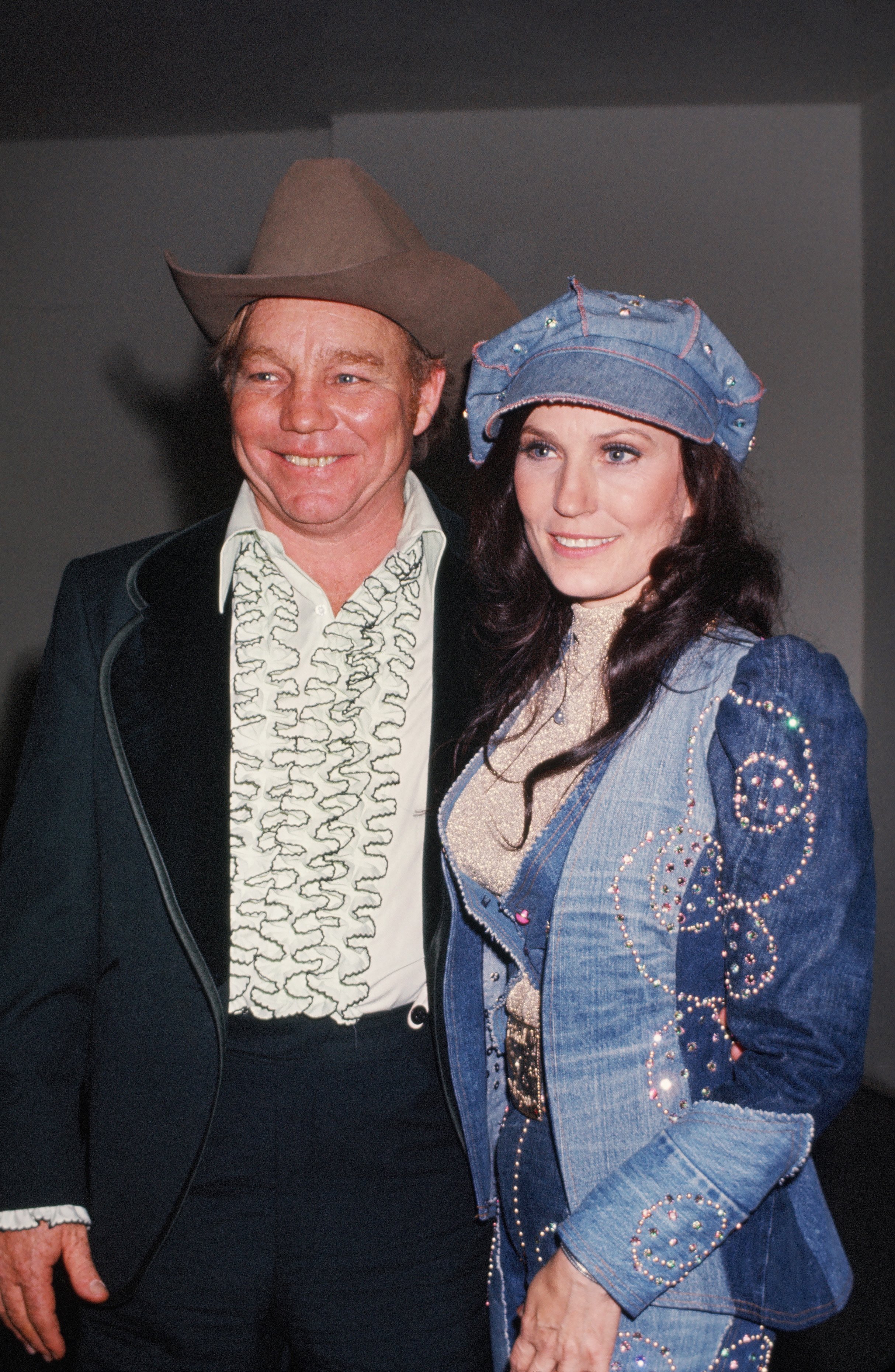 Loretta Lynn and her husband Oliver Vanetta "Doolittle" Lynn at a soiree in circa 1976 | Sources: Getty Images