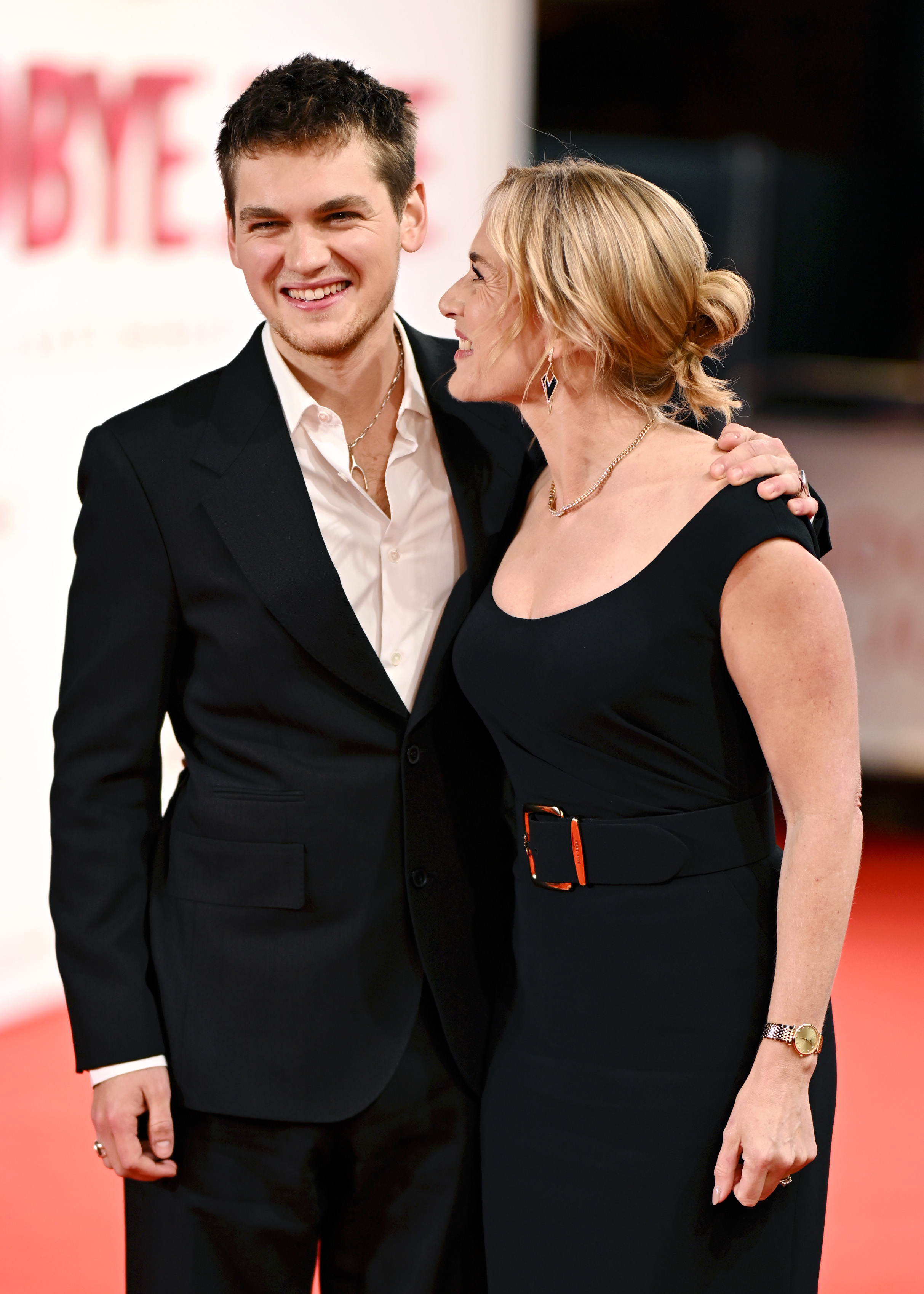Joe Anders — formerly known as Joe Alfie Winslet Mendes — shared a beaming moment with his mother on the red carpet at the world premiere of "Goodbye June" on December 3, 2025, at the Curzon Mayfair in London, England. Dressed in coordinated black, the pair looked perfectly in sync, with Anders smiling warmly as Kate Winslet turned to him, mid-laugh.