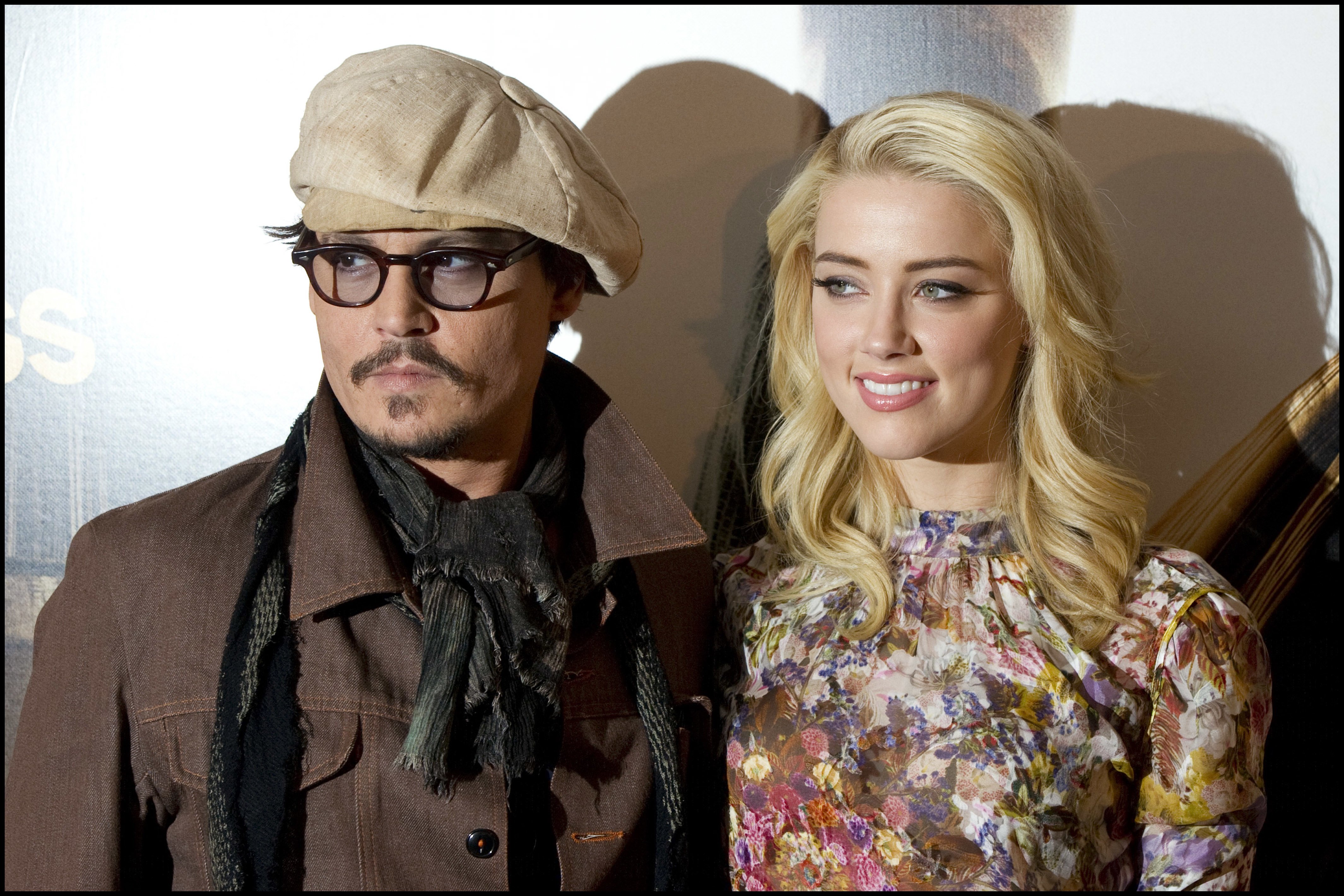 Johnny Depp and Amber Heard in Paris for the photocall of "The Rum Diary" on November 8, 2011 | Source: Getty Images